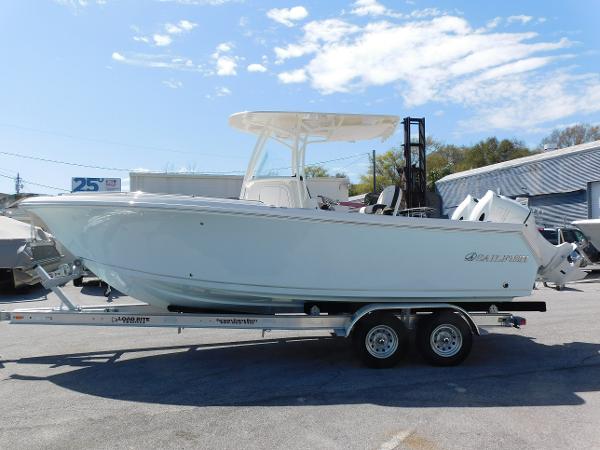 2024 Sailfish 242 CC boat on a trailer in a marina.