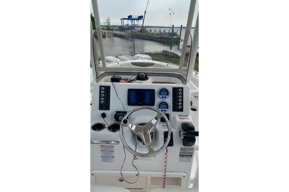 2017 Robalo R222 Center Console boat dashboard with steering wheel and navigation controls.