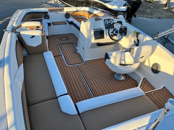 2024 Starcraft SVX 191 boat interior with tan and white seating and modern dashboard.
