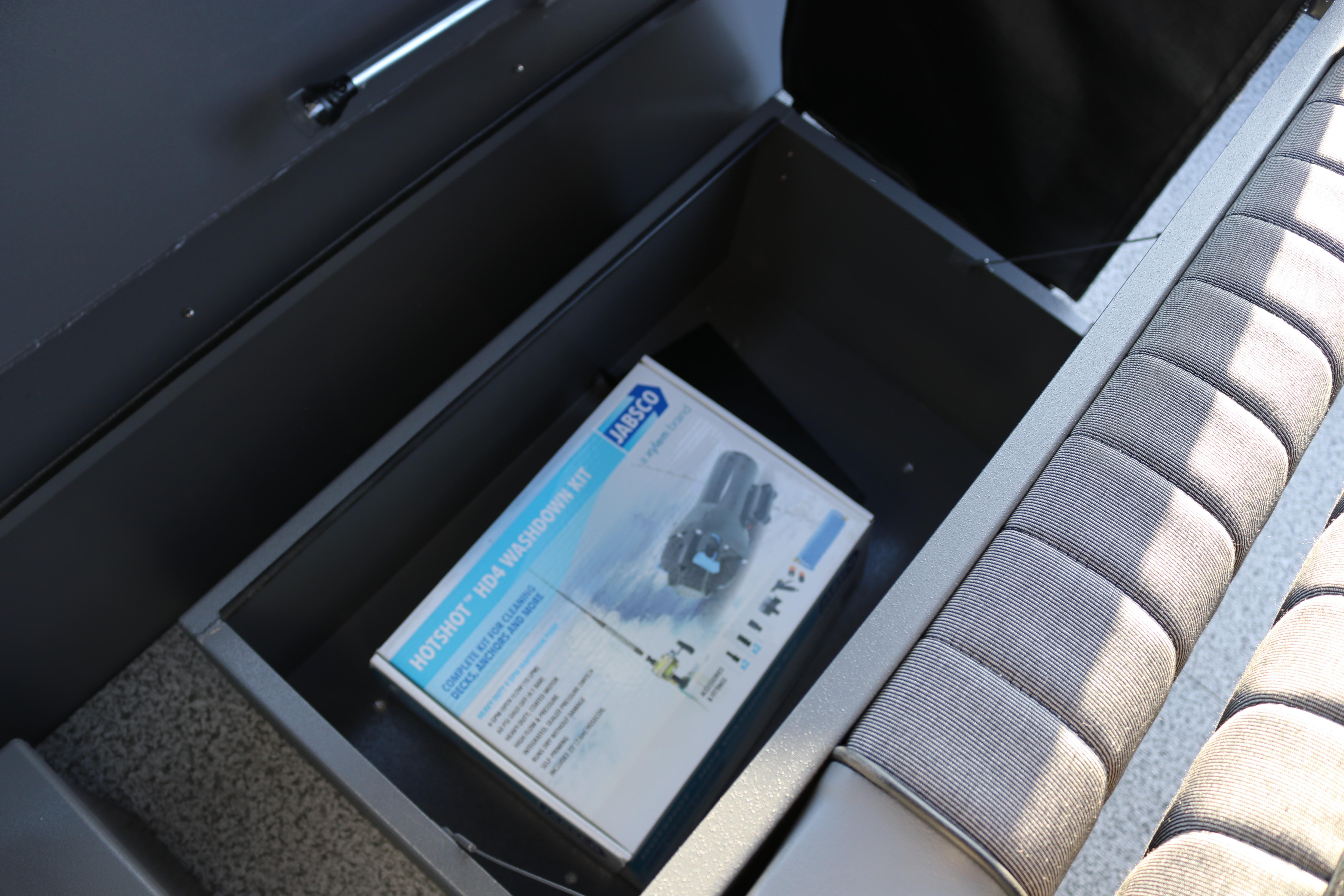 Storage compartment in 2026 Alumaweld Stryker X202 boat with Jabsco washdown kit.