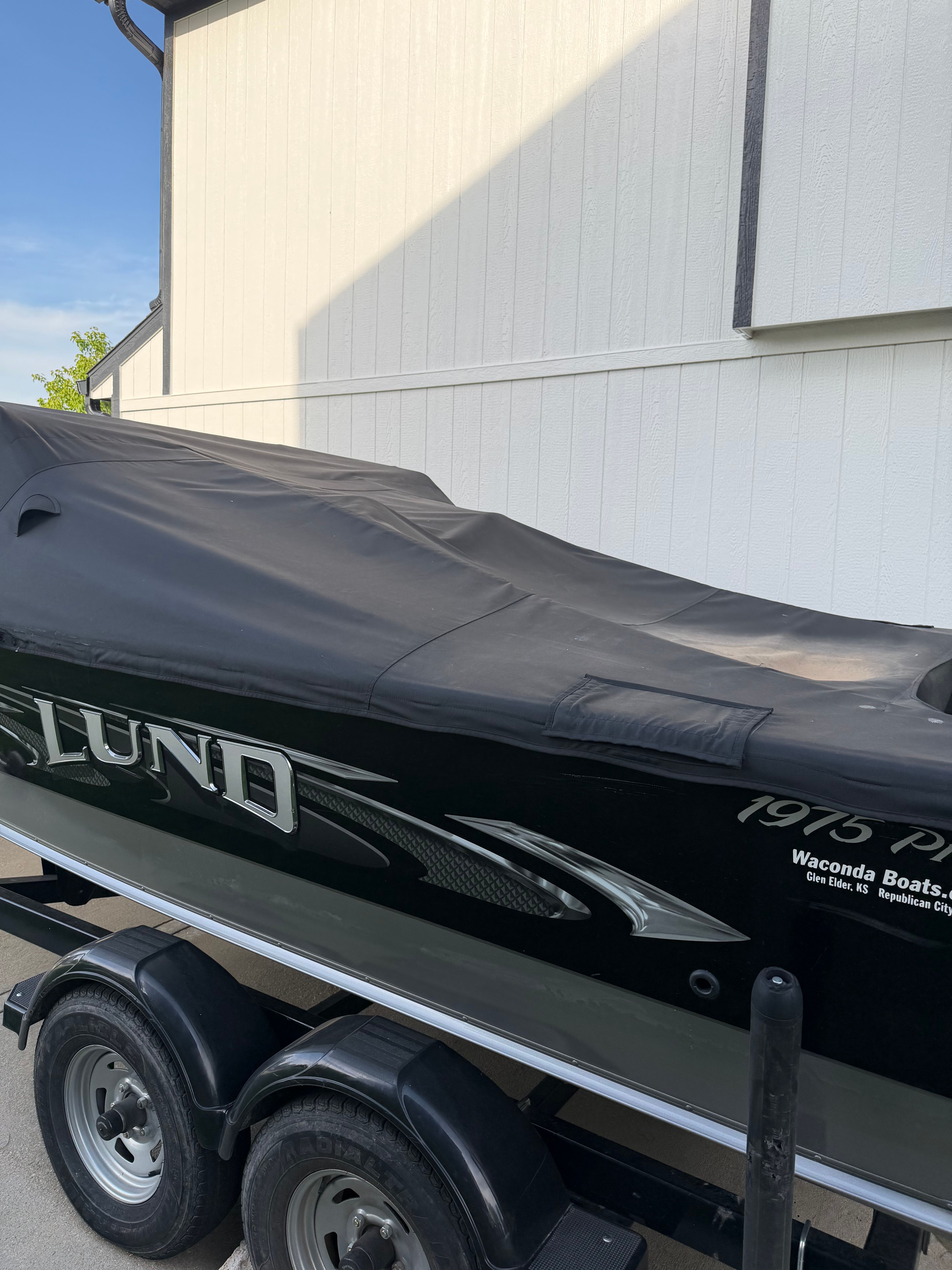 2017 Lund Pro V 1975 boat with cover on trailer.