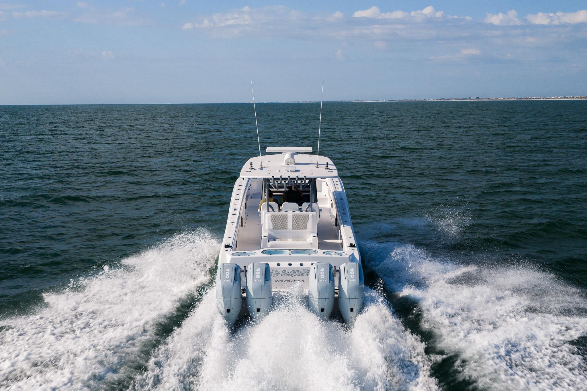 2026 Front Runner 37 Catamaran cruising on open water, rear view.