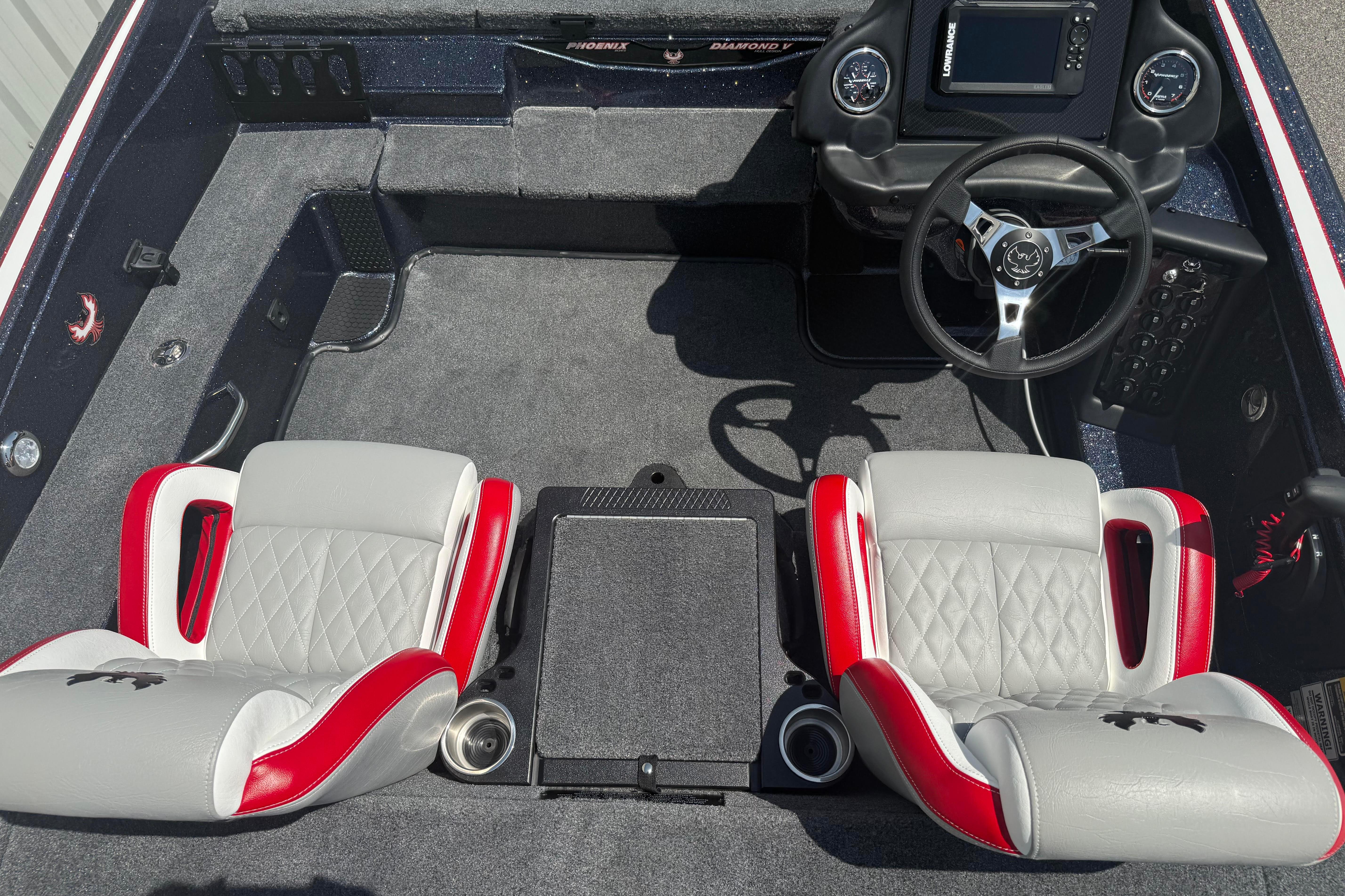 Interior of 2027 Phoenix 819 ZXL boat with dual seats and steering console.