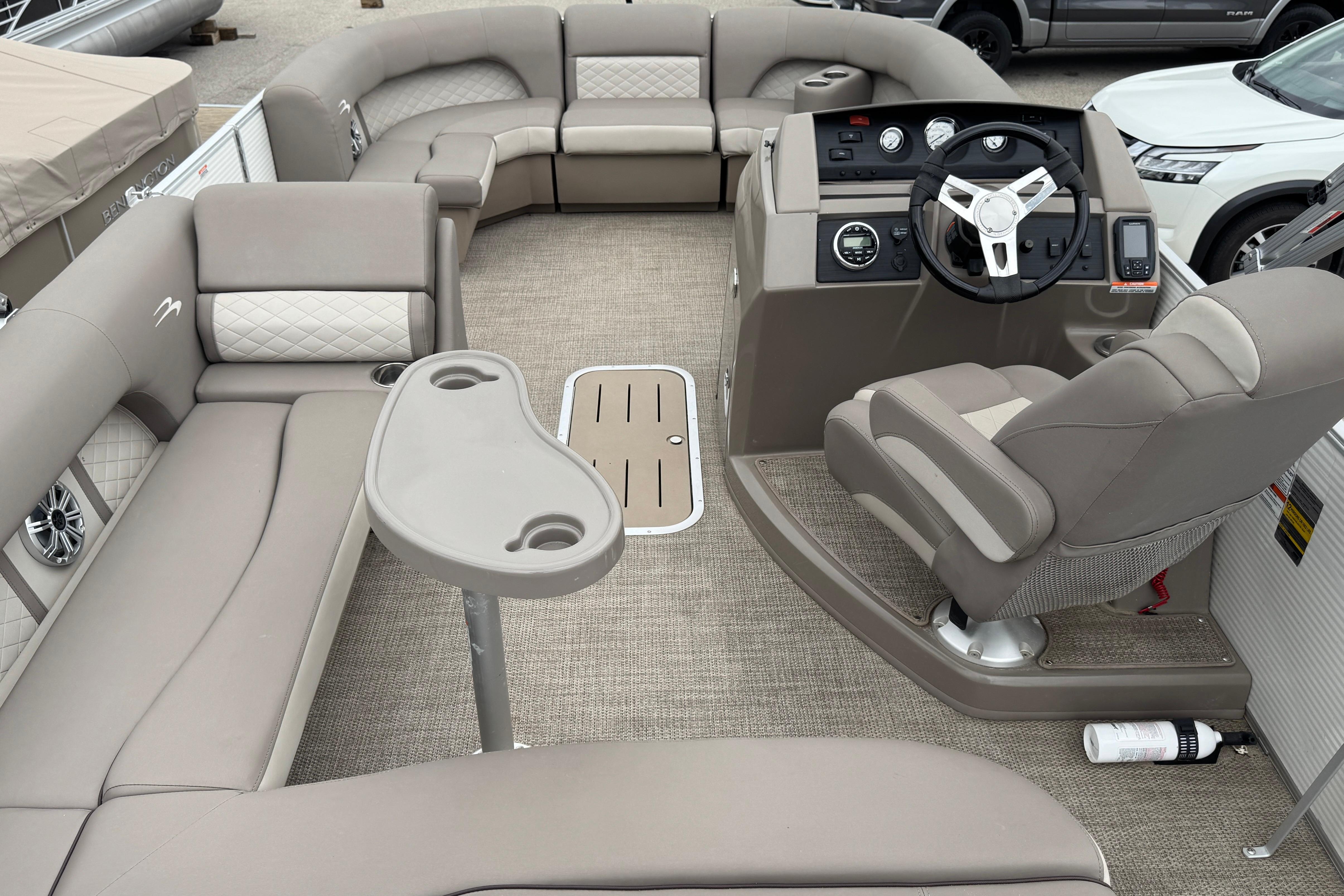2019 Bennington SX 22 SSBXP pontoon boat interior with plush seating and modern helm.