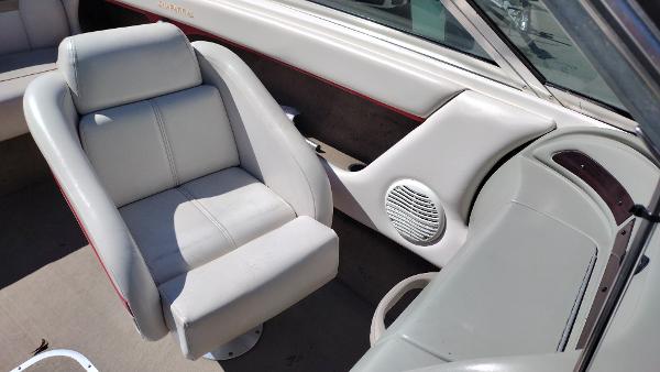 1999 Chaparral 2130 SS boat interior with gray seating and speaker detail.