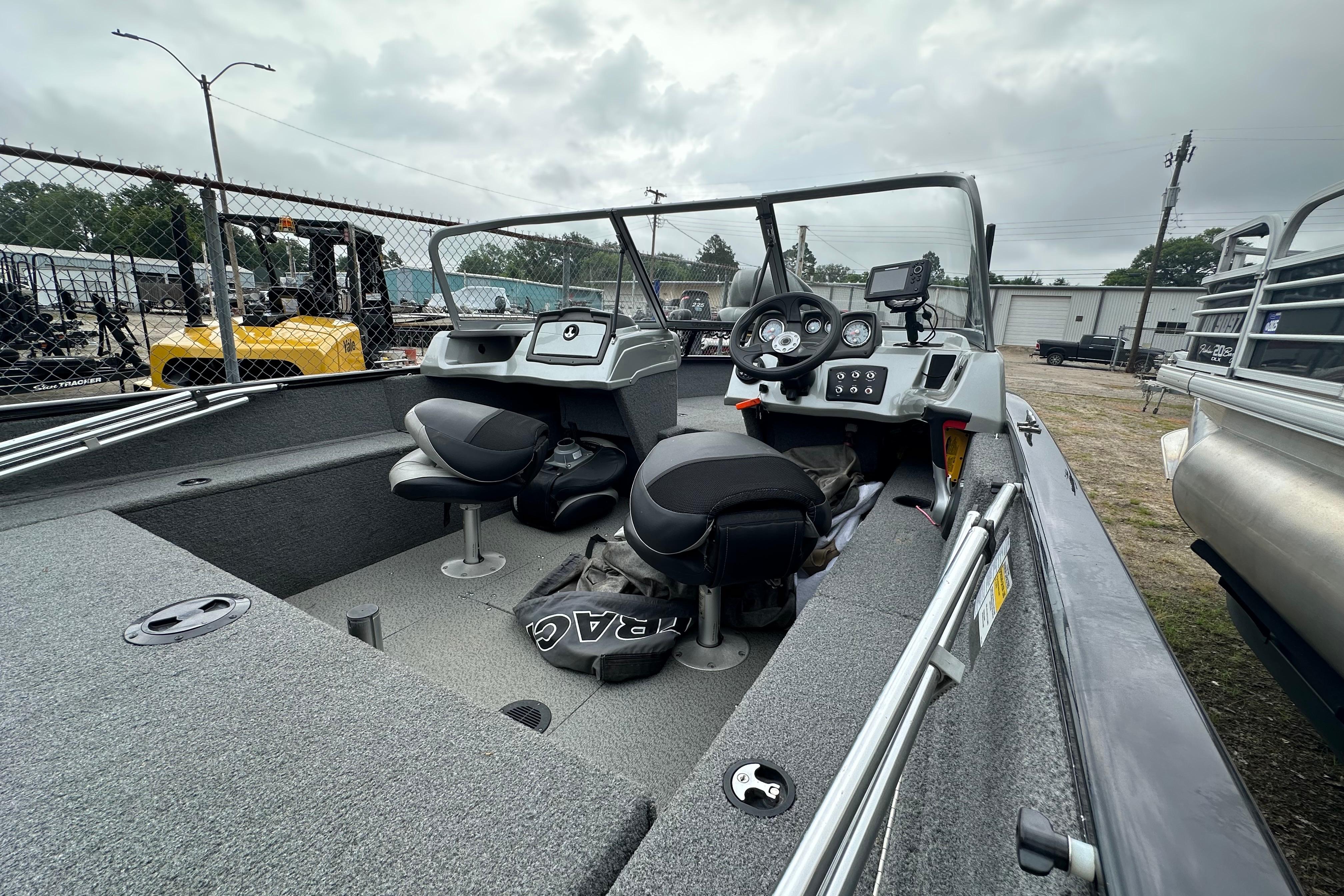 2018 Tracker Pro Guide V-175 Combo boat interior with steering console and seating.