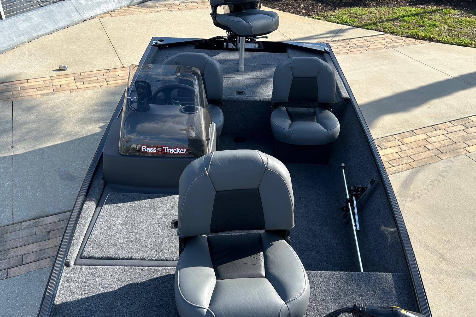 2026 Tracker Bass Tracker Classic XL boat interior with seating and steering console.