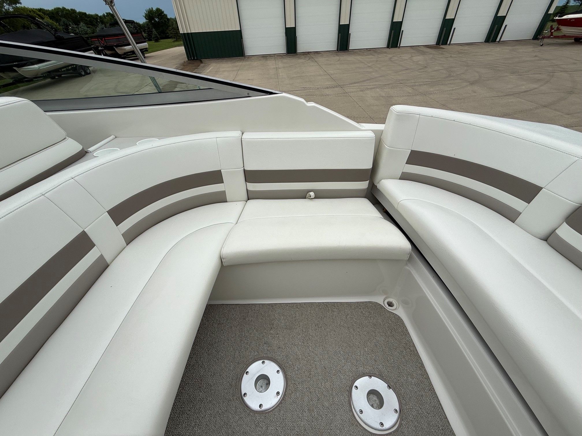 Interior of a 1998 Formula Thunderbird boat with white seating.