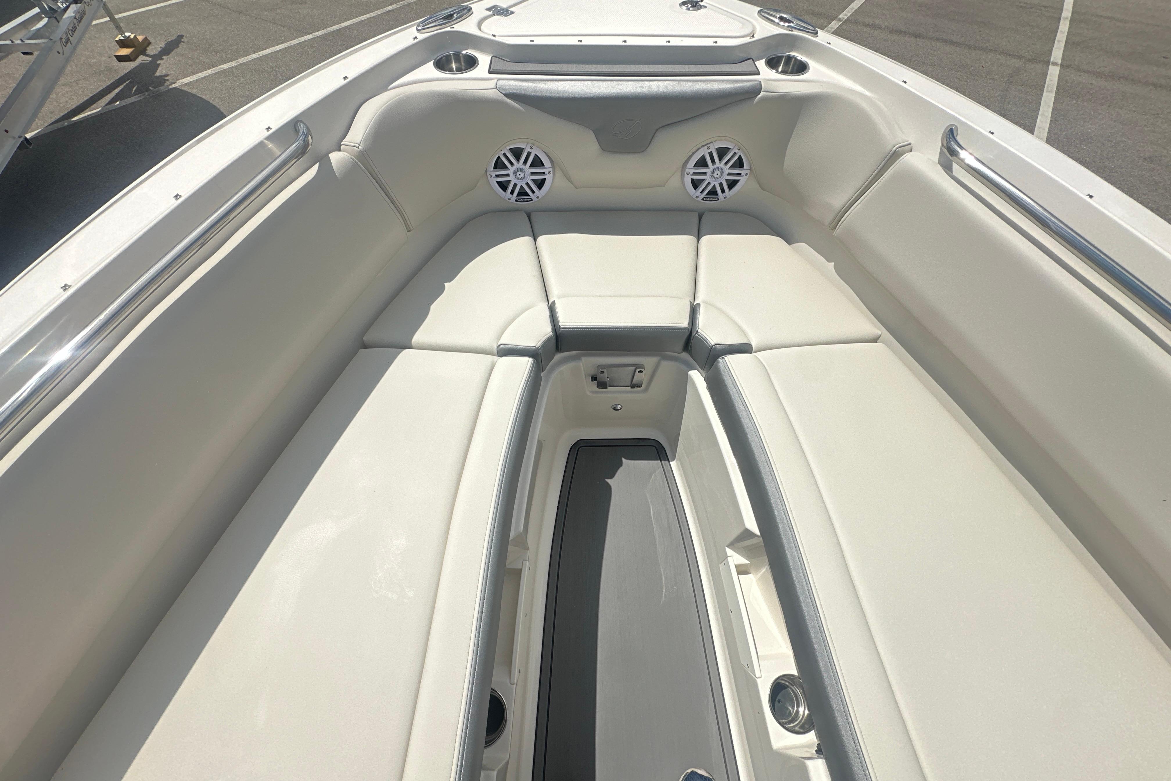 2026 Sailfish 226 DC boat interior with cushioned seating and built-in speakers.