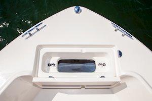 2026 Grady-White Fisherman 180 boat bow with storage compartment, on calm water.