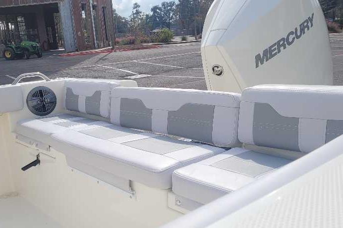 2026 Mako 214 Center Console boat with Mercury engine, featuring spacious seating.