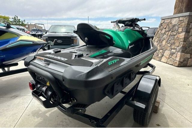 A Sea-Doo jet ski on a trailer, ready for the water.