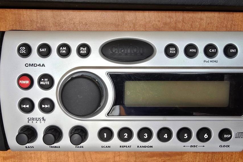 Clarion CMD4A stereo system on 2006 Sea Ray 240 Sundancer boat dashboard.