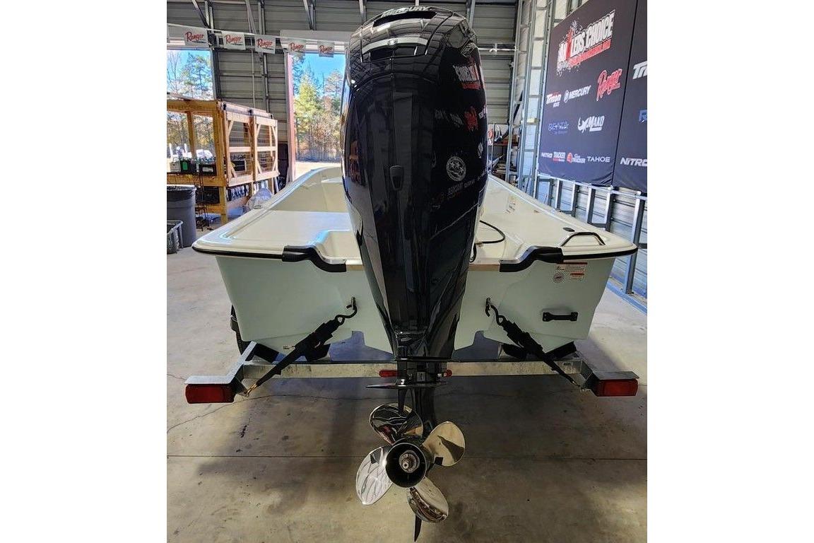 2026 Mako Pro Skiff 17 CC boat on trailer in a garage setting.