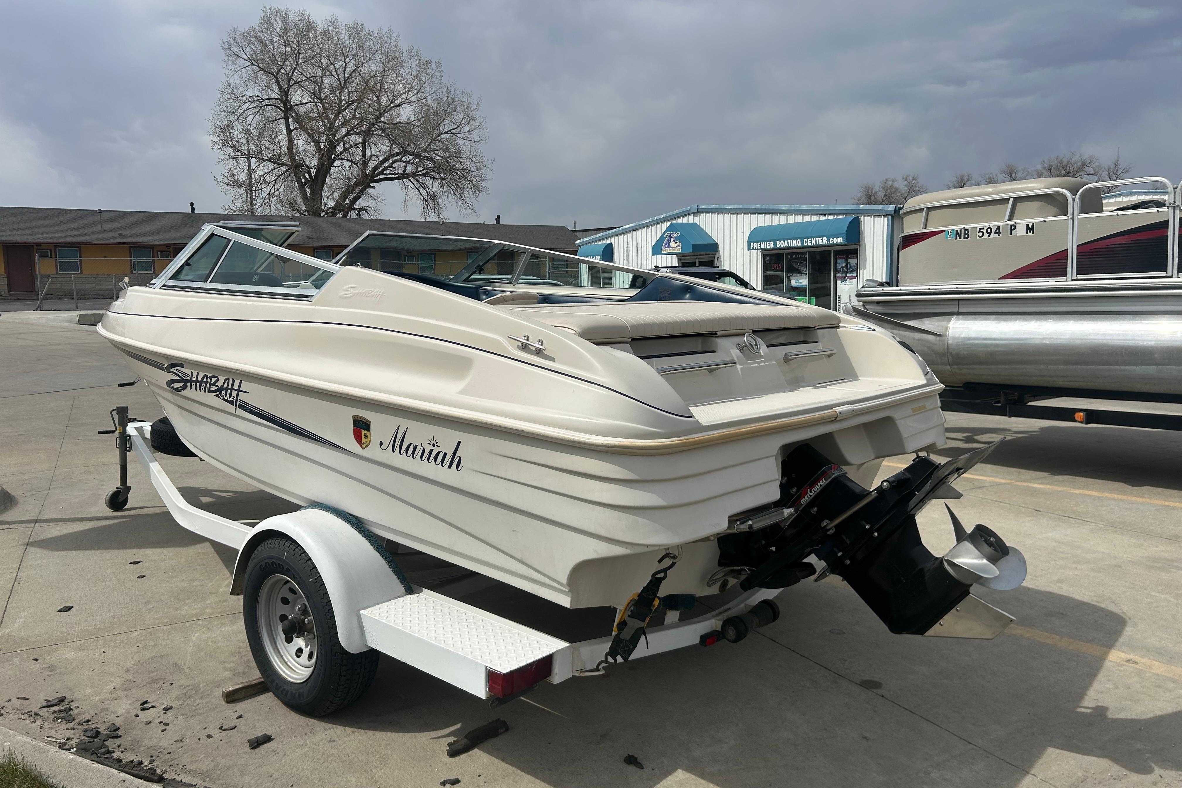 1996 Mariah 180 Shabah boat on trailer in a parking lot.