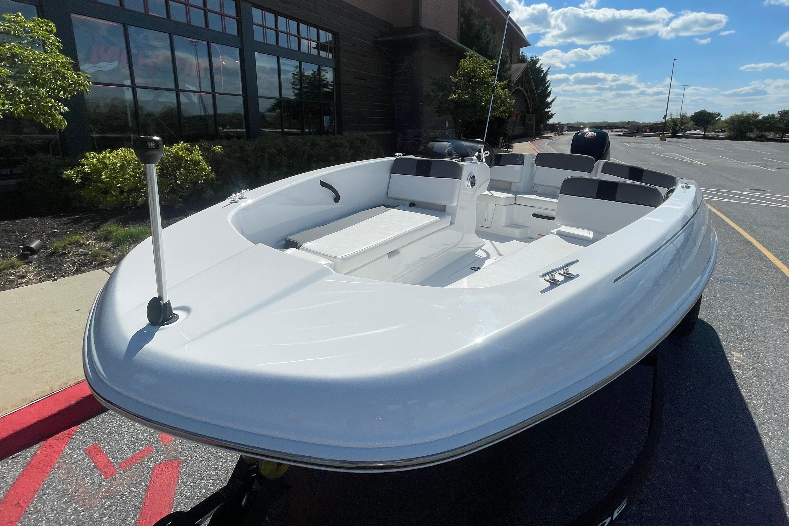 2026 Tahoe T18 boat displayed outdoors under a clear blue sky.