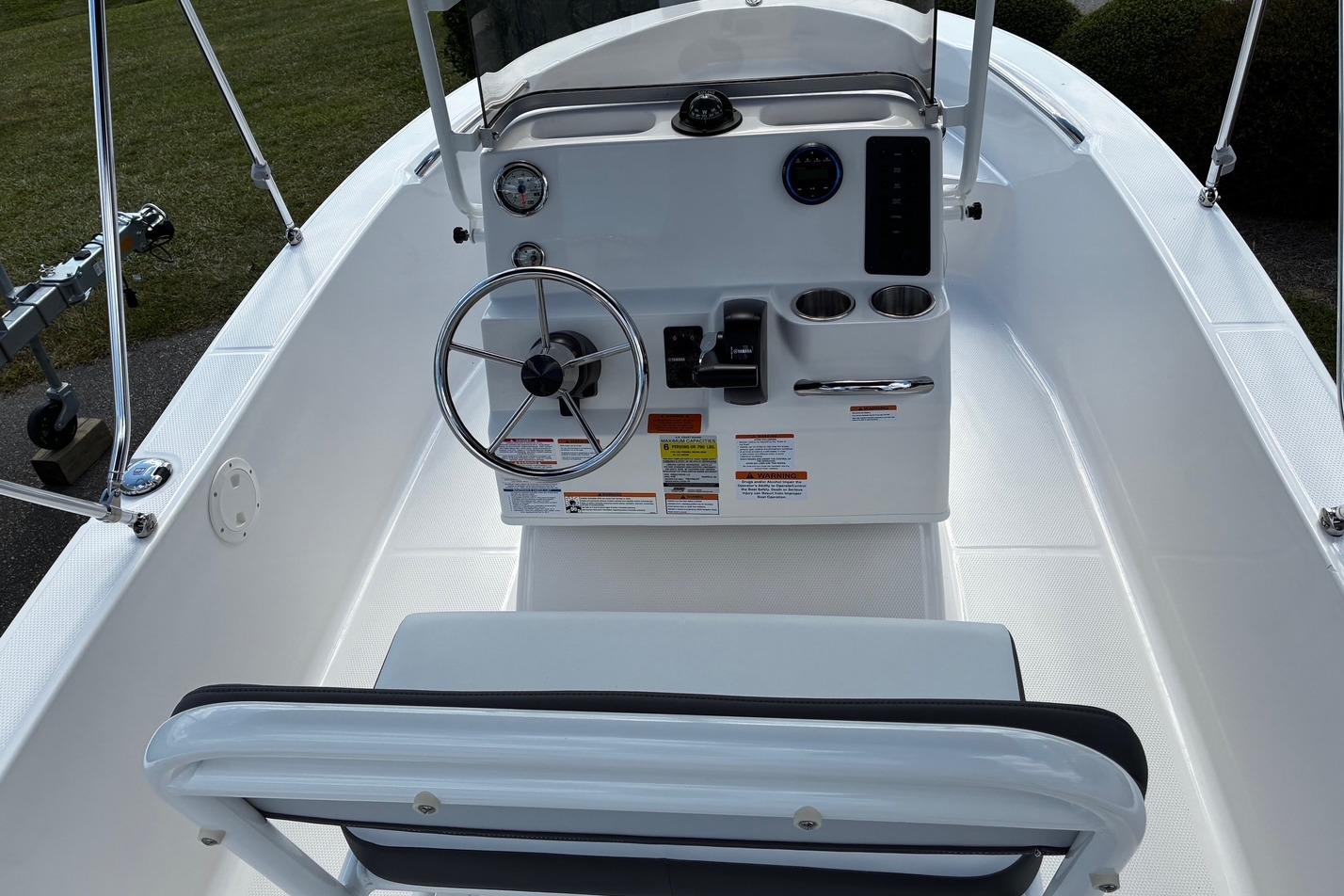 2026 Robalo R160 Center Console boat interior with steering wheel and control panel.