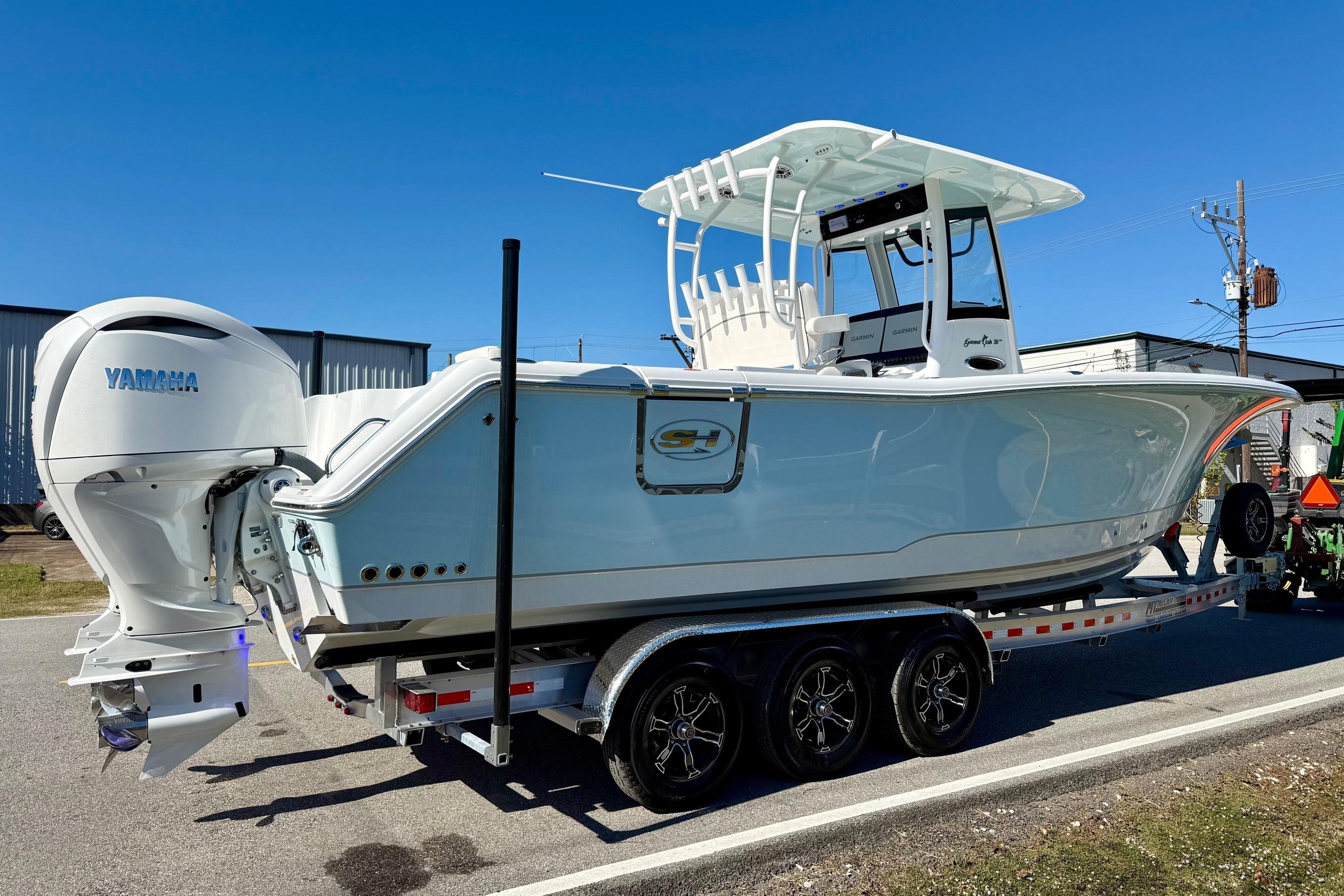2026 Sea Hunt Gamefish 30 Coffin Box boat on trailer, featuring Yamaha engine.