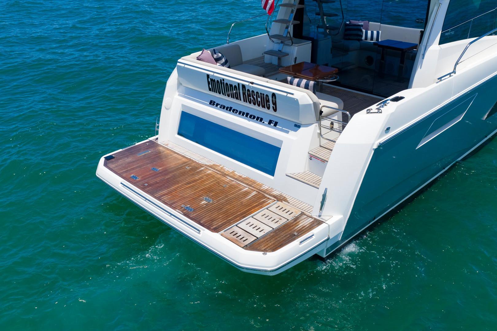 2022 Prestige 520 yacht on water, featuring spacious deck and elegant design.