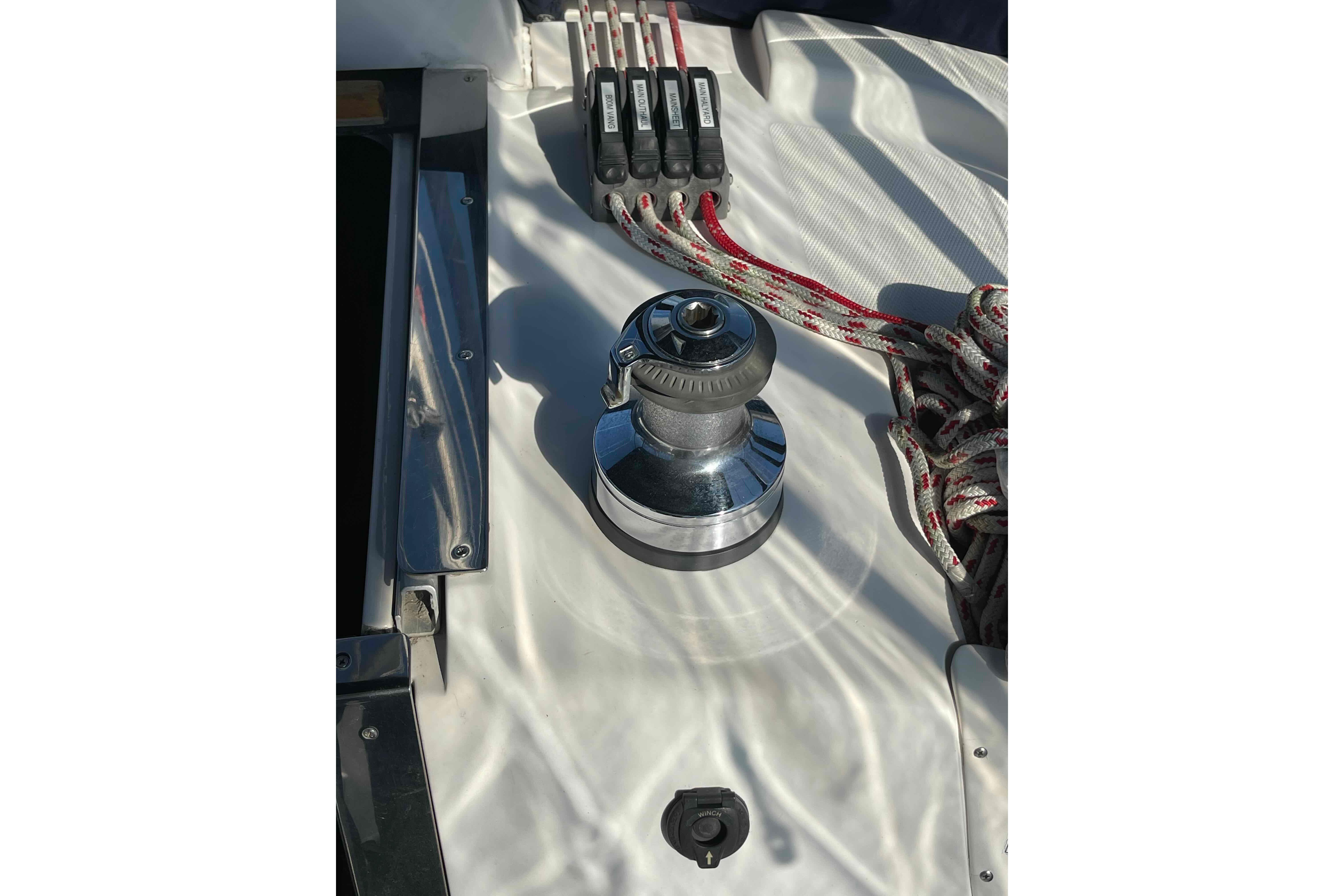 Winch and ropes on 2010 Hunter 45 Center Cockpit sailboat deck.
