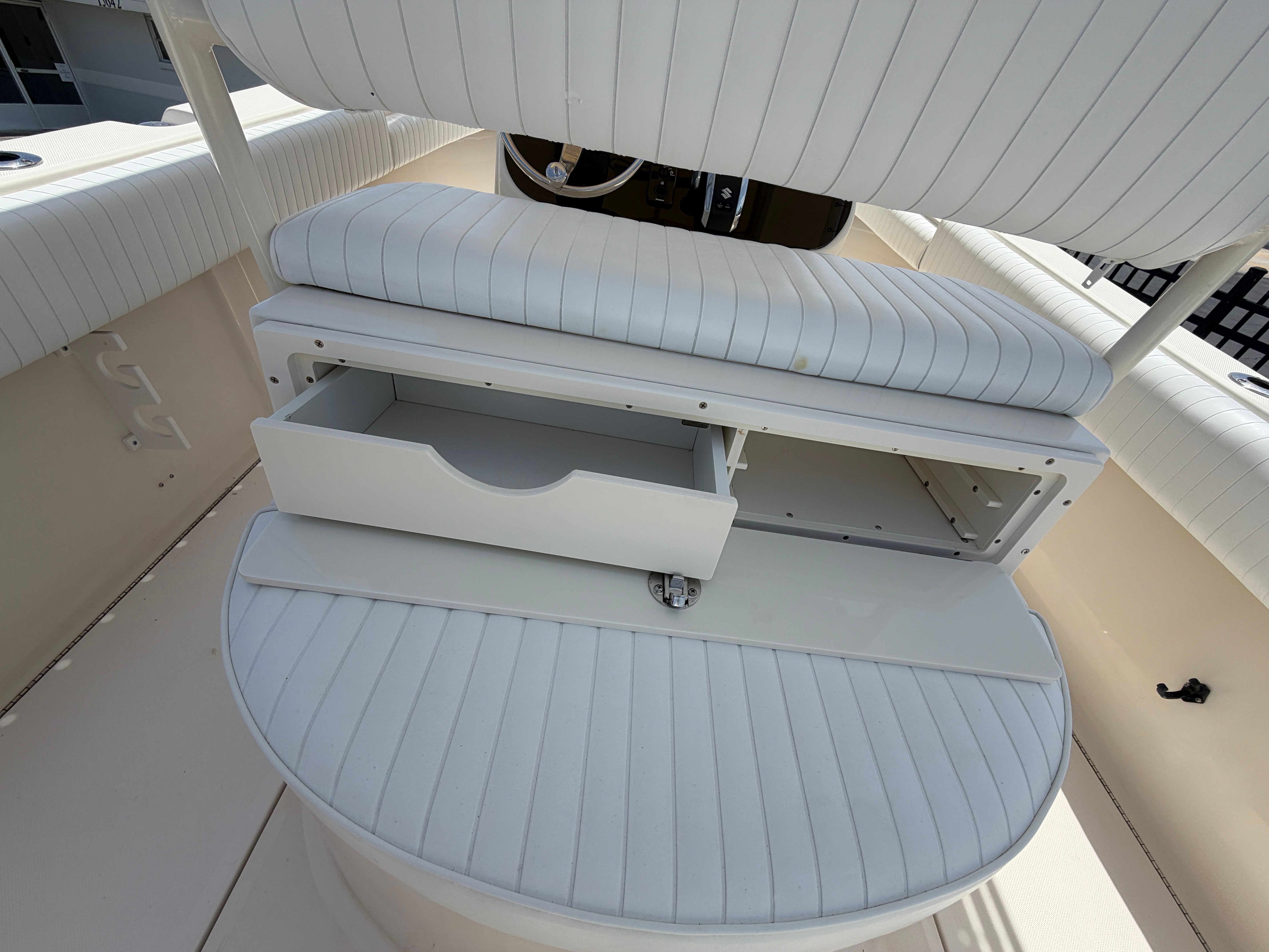 Interior view of a 2004 McKee Craft 24 FREEDOM boat with storage.