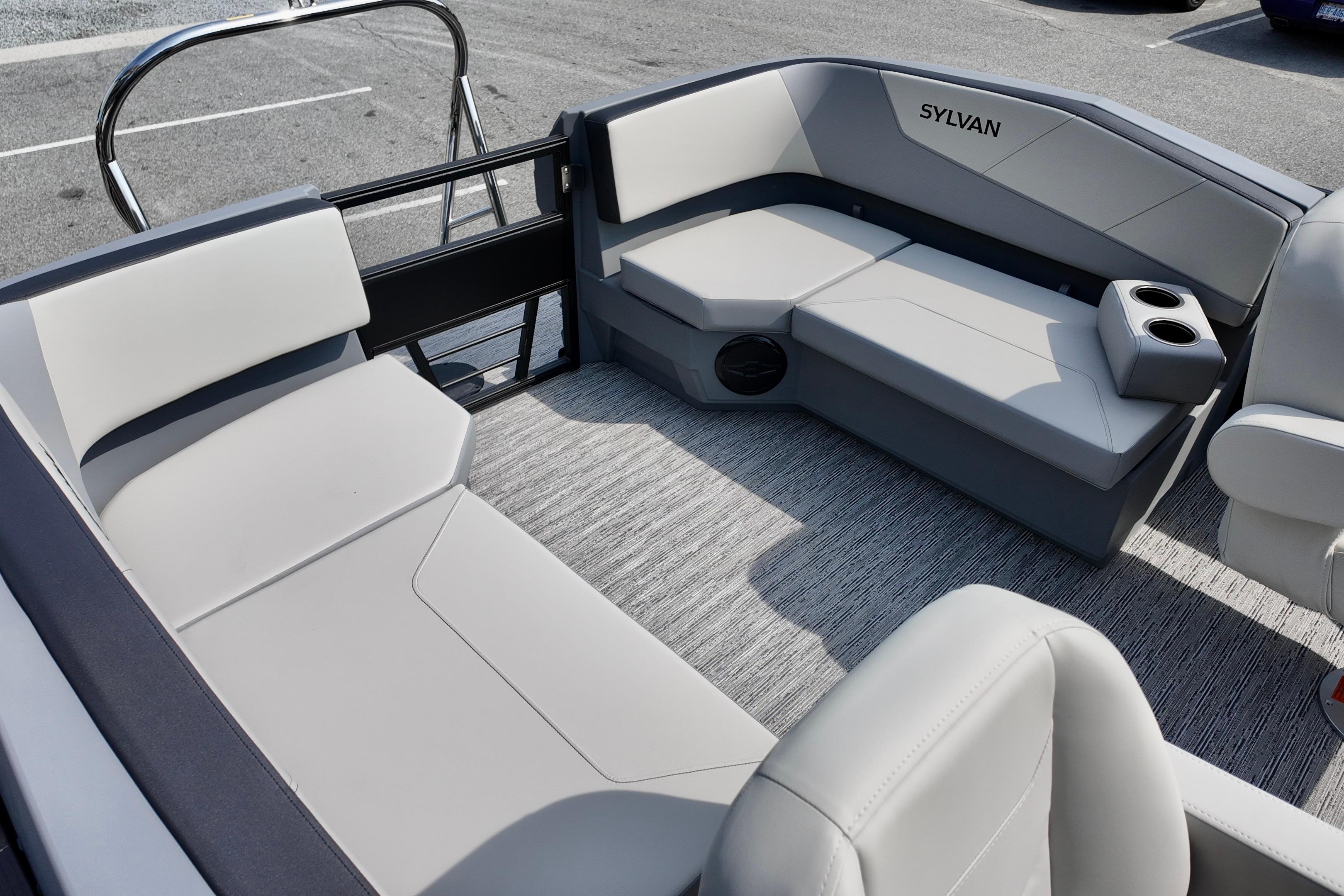 Luxurious interior of 2026 Sylvan A-20 LZ DH pontoon boat with plush seating.