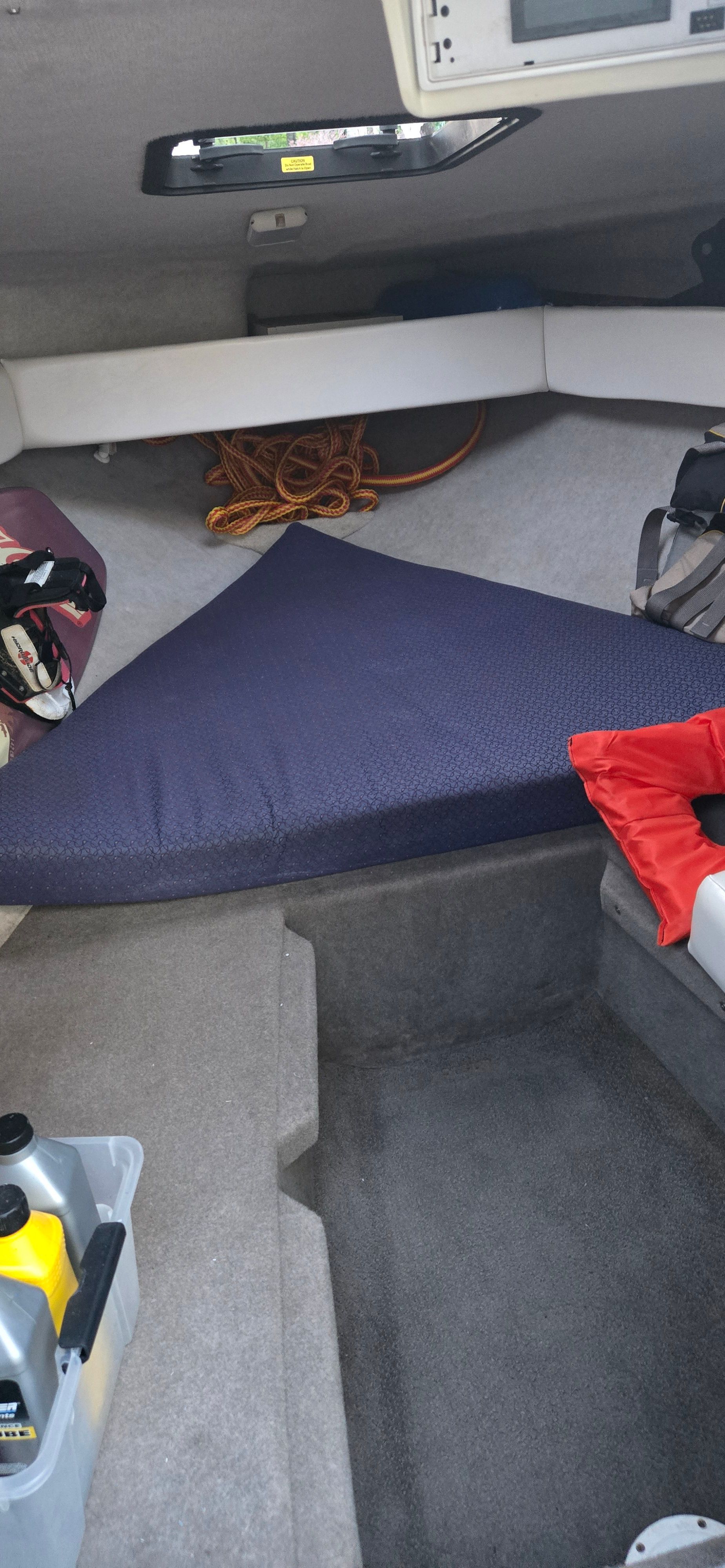 Interior of a 2004 Bayliner B210 Classic with sleeping area.