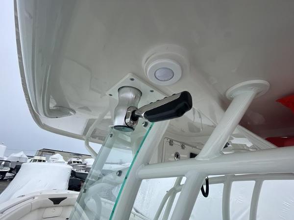 2023 Sailfish 290 CC boat interior, featuring a control handle and modern design elements.