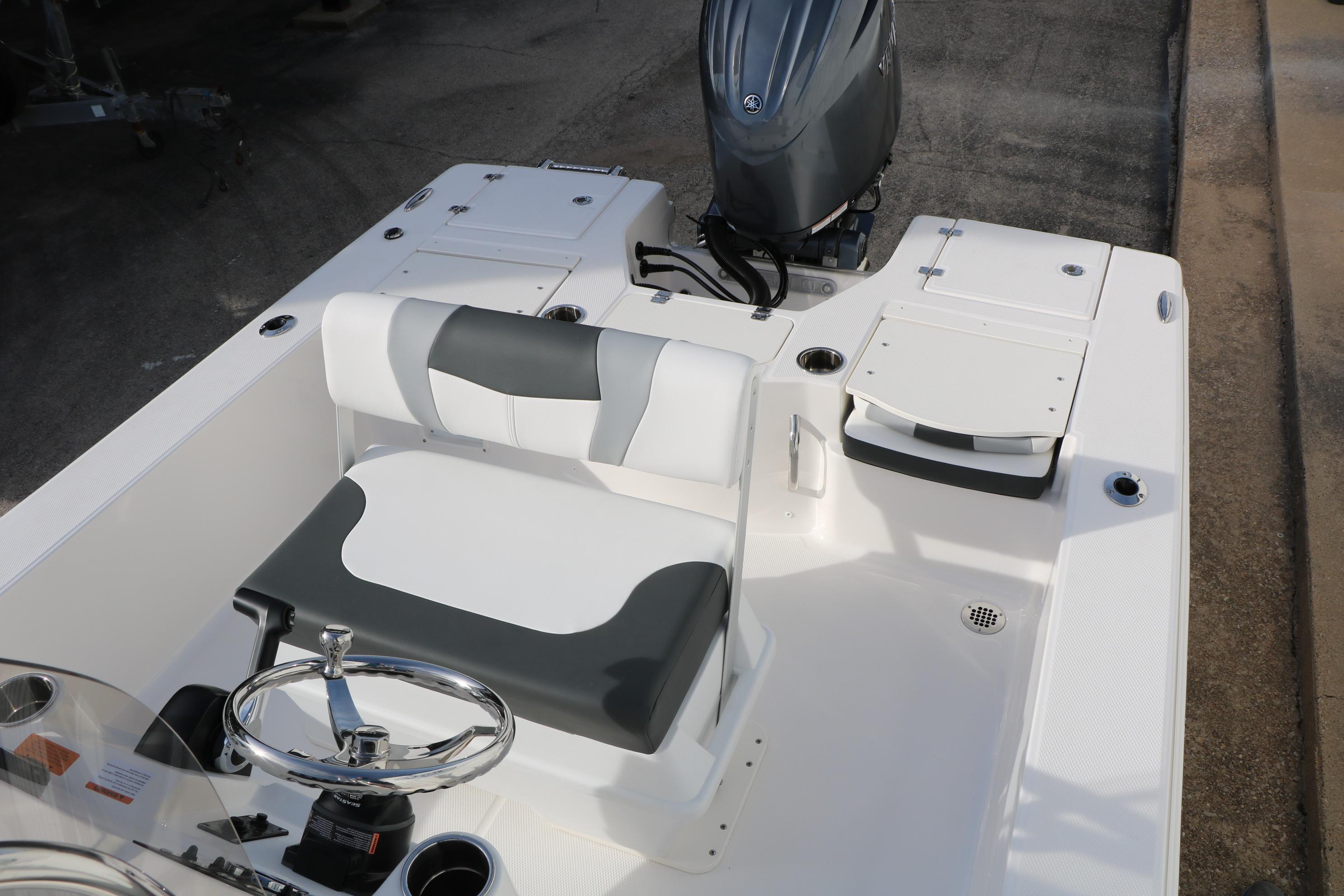 2026 Robalo 206 Cayman boat interior with steering wheel and seating.