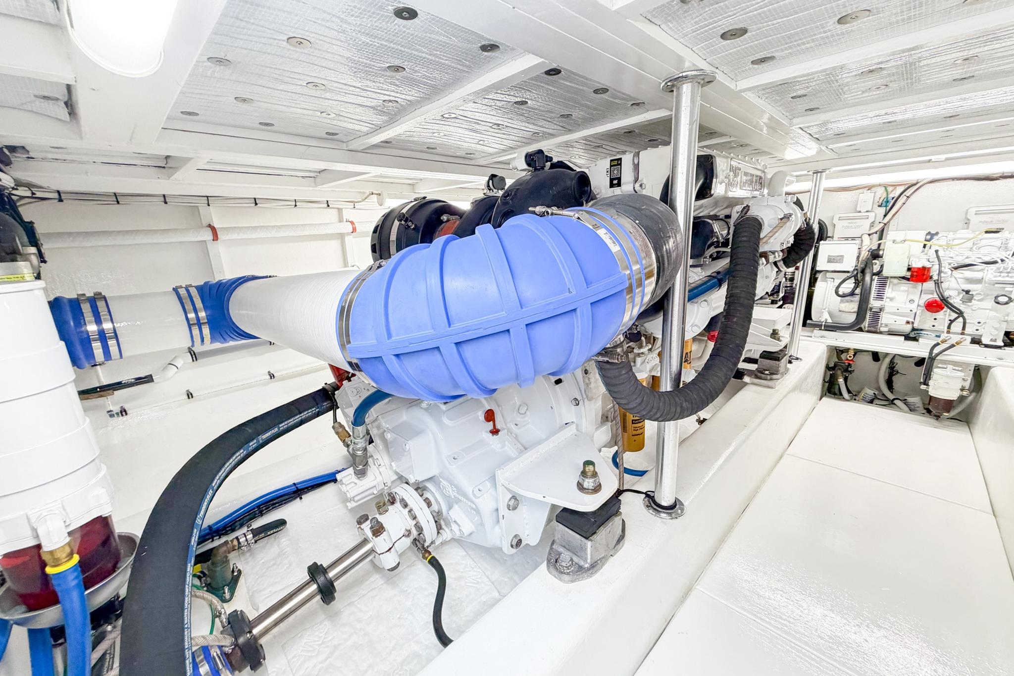 Engine room of a 1998 Blackwell Custom Carolina Sportfish boat, showcasing mechanical components.