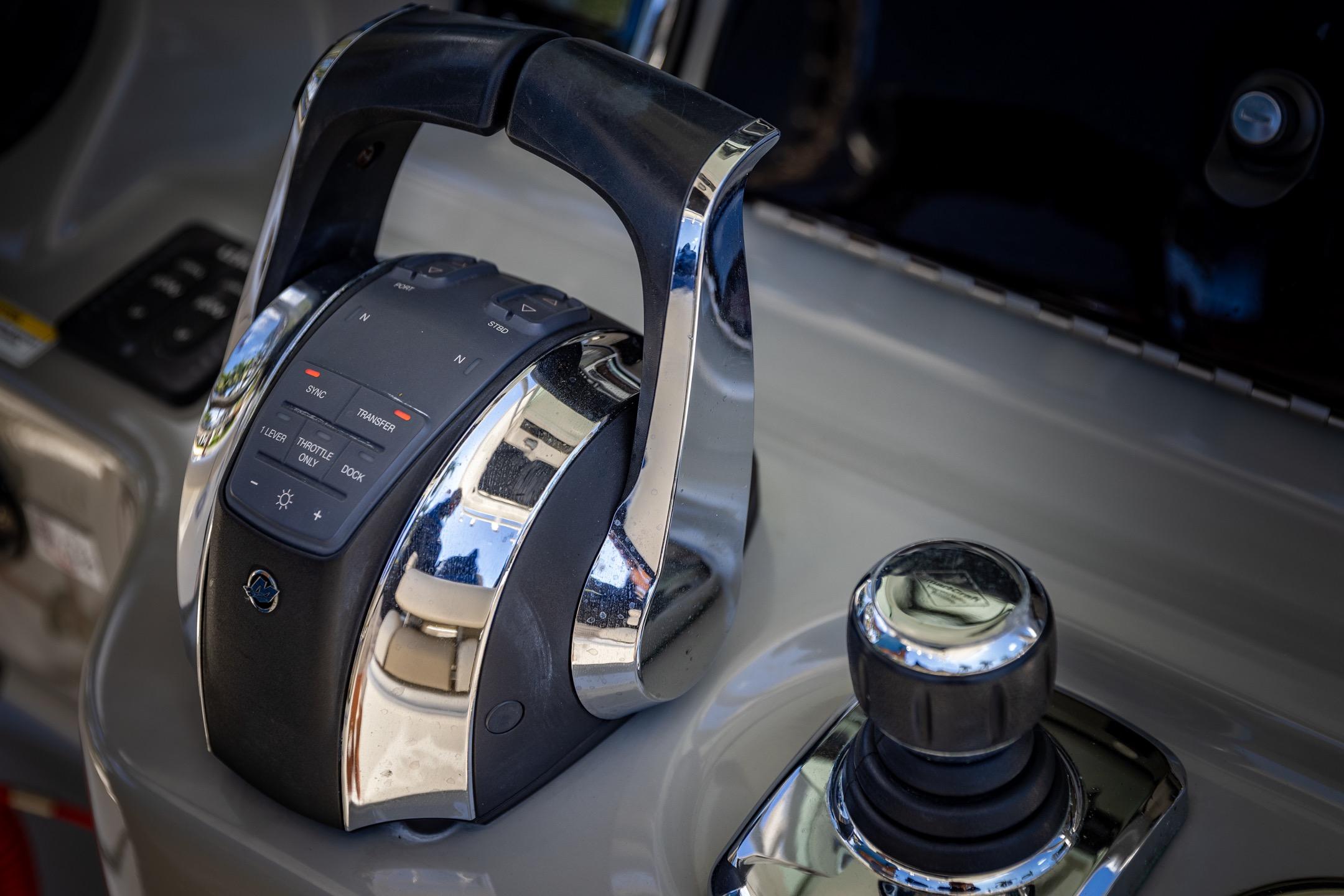 Control panel of a 2016 Boston Whaler 280 Outrage boat, featuring throttle and joystick.