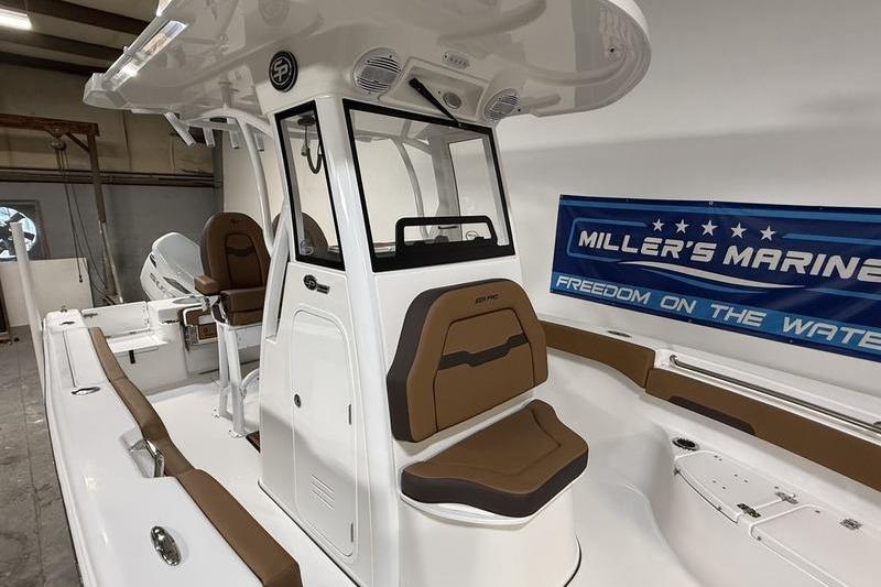 2026 Sea Pro 242 Center Console boat with brown seating, showcased at Miller's Marine.