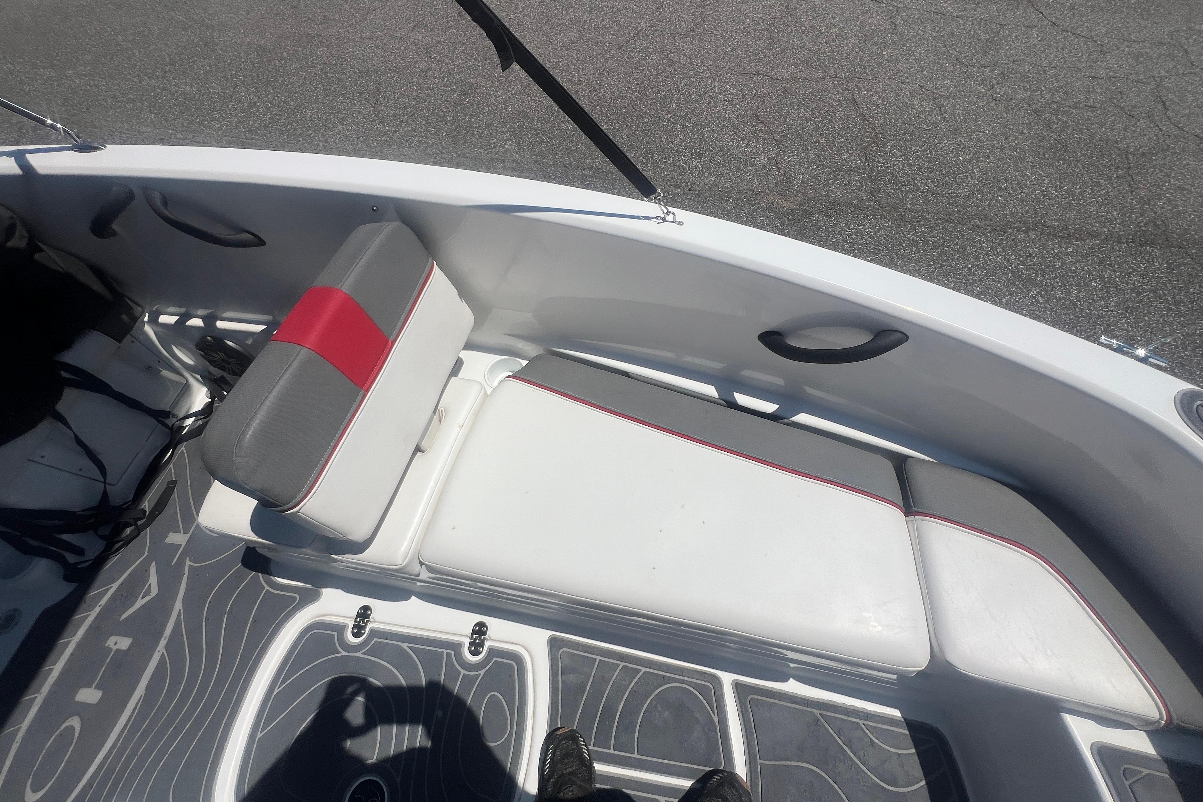 2023 Tahoe T16 boat interior with gray and red seating, sleek design.