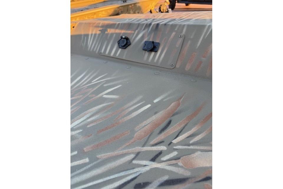 2025 Tracker Grizzly 1654 T Sportsman boat with camouflage pattern detail.