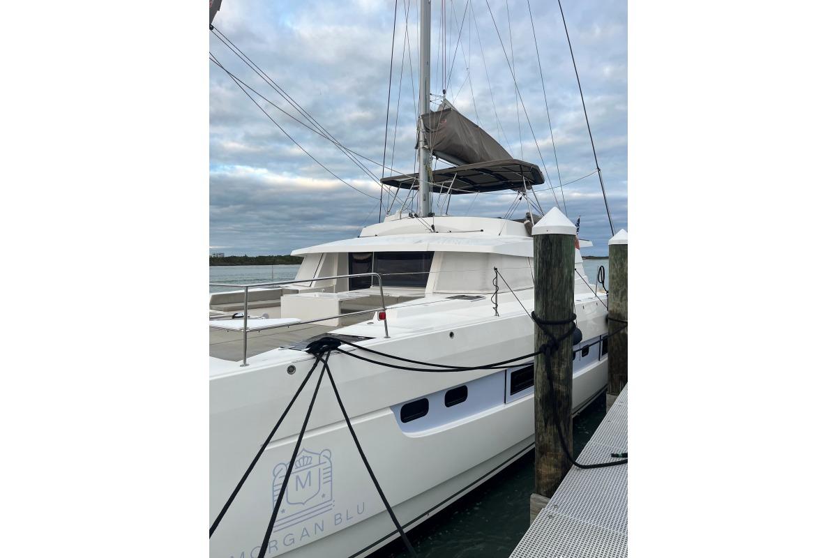 Luxury Bali 5.4 catamaran docked, 2021 model, with sleek design and spacious deck.
