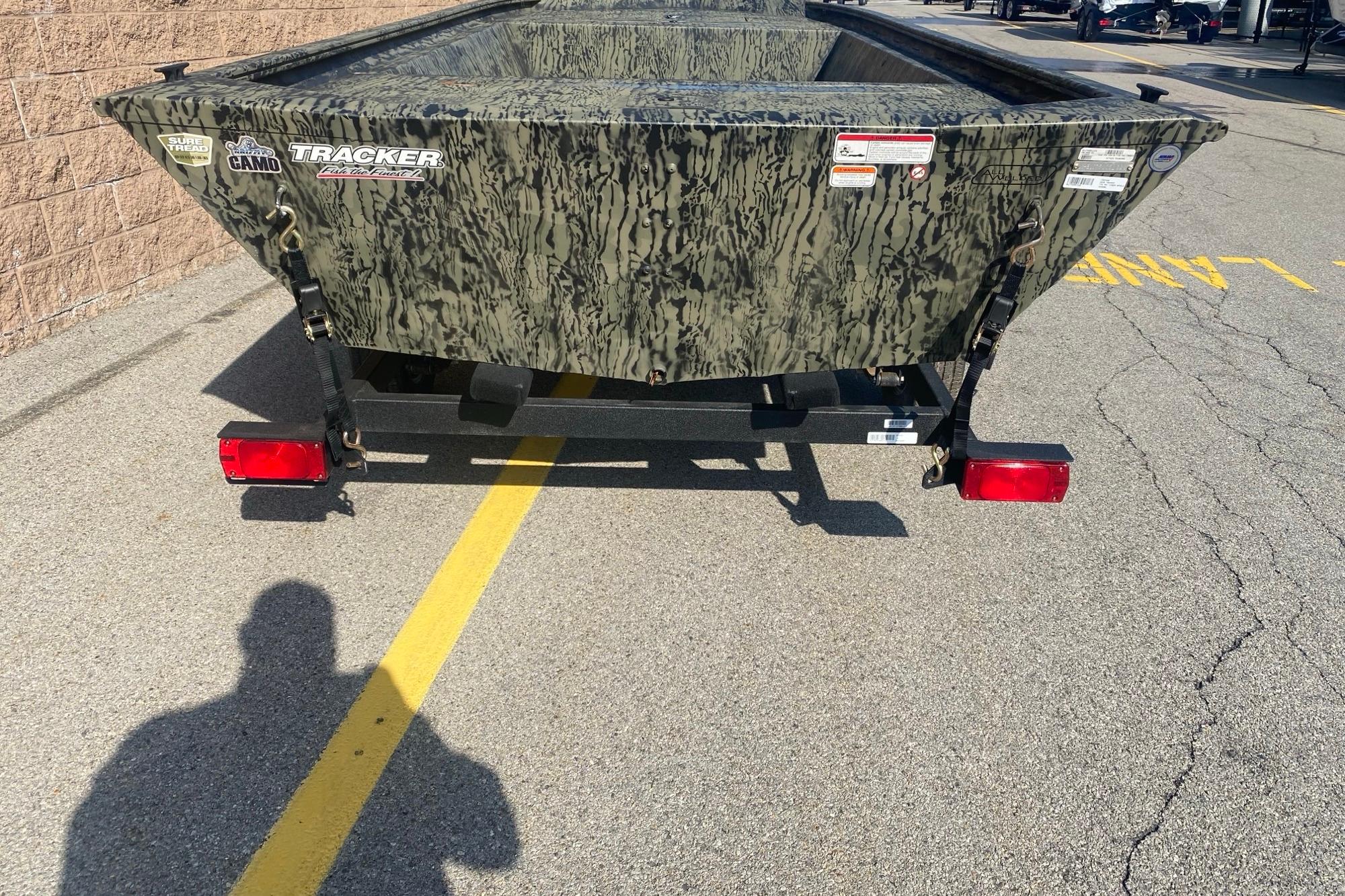 2026 Tracker Grizzly 1648 Utility boat with camouflage design on a trailer.