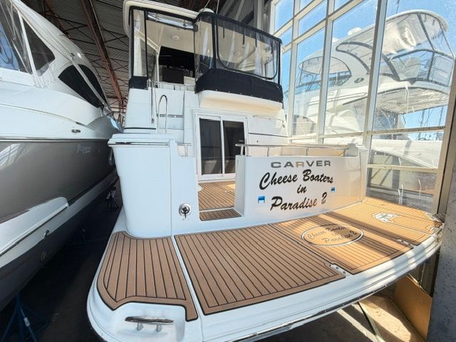 Rear view of a 2005 Carver 44 Cockpit Motor Yacht in a storage facility.