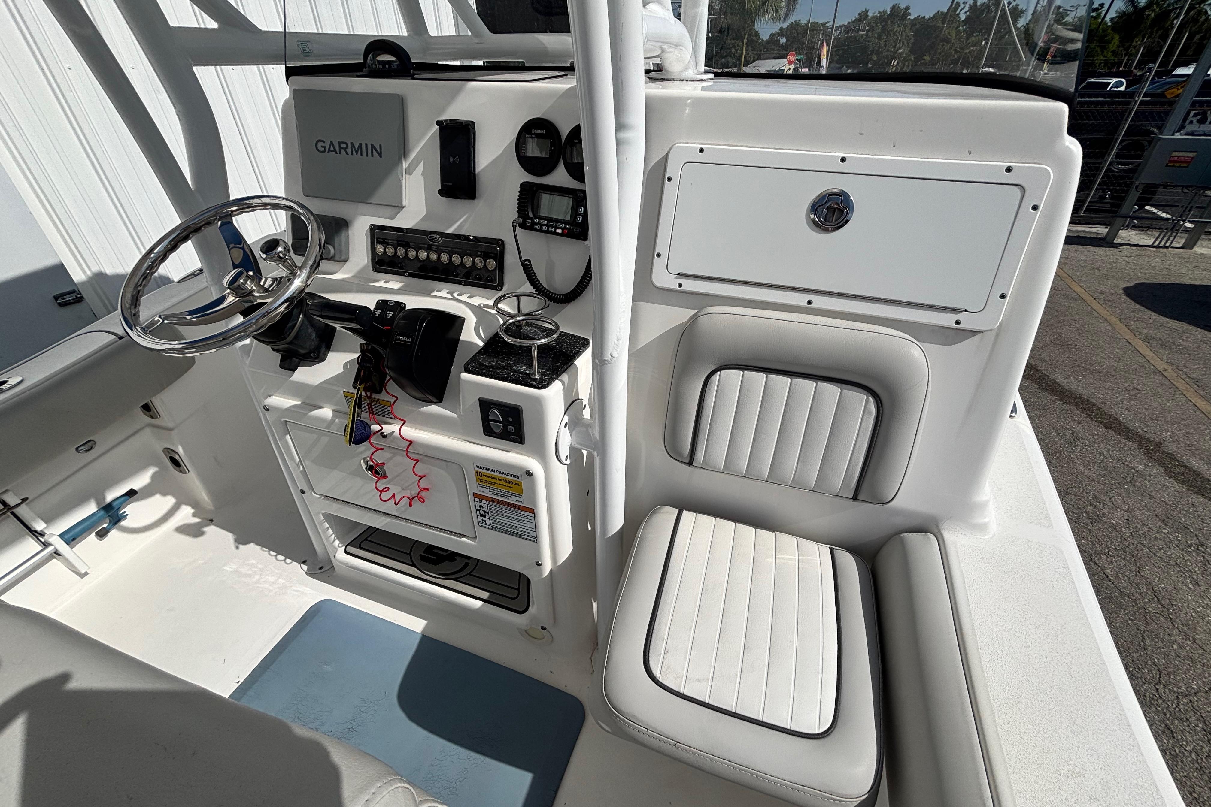 2021 Sea Fox 249 Avenger boat cockpit with Garmin navigation and cushioned seating.