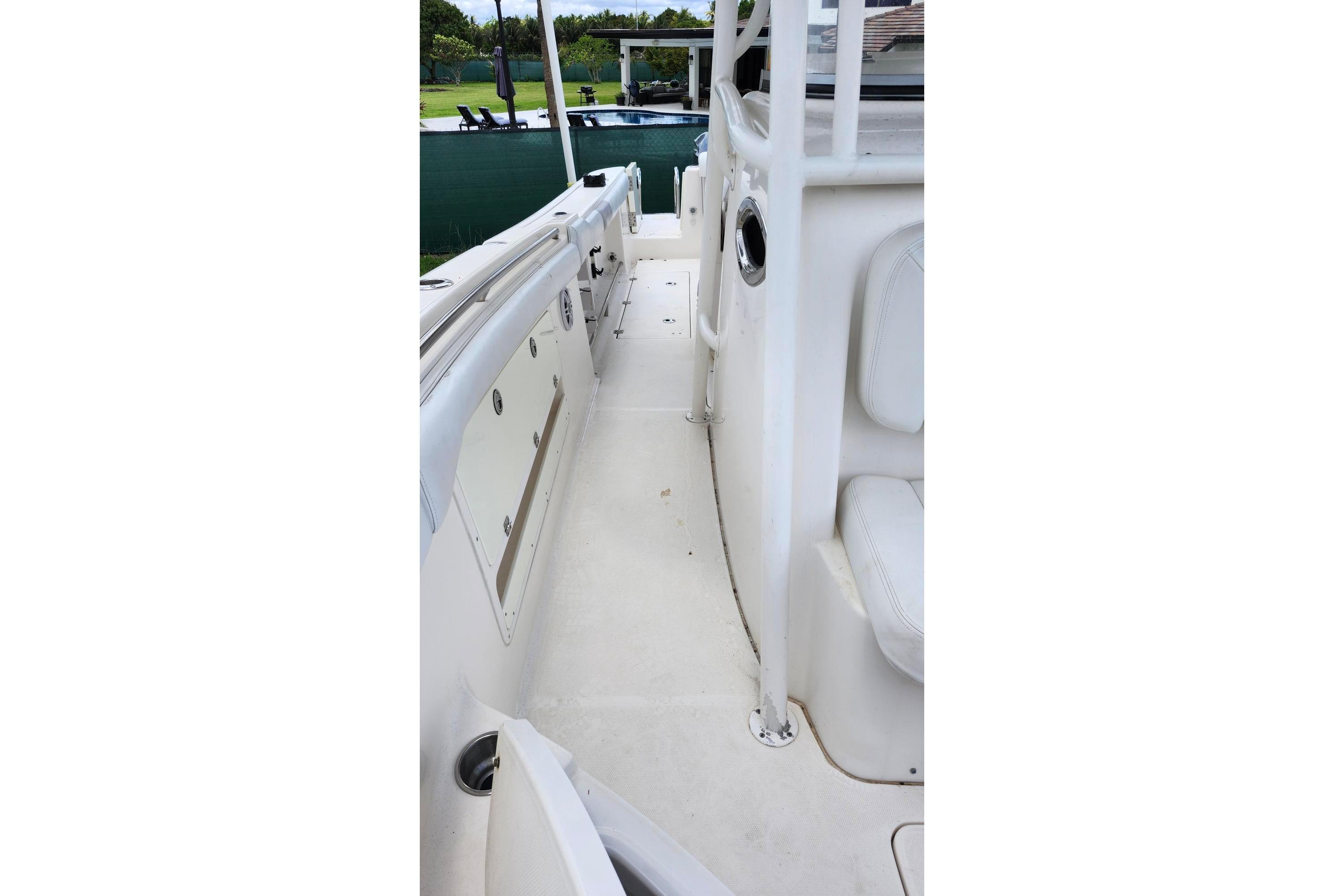 2015 Robalo R300 Center Console boat interior, featuring white seating and deck.