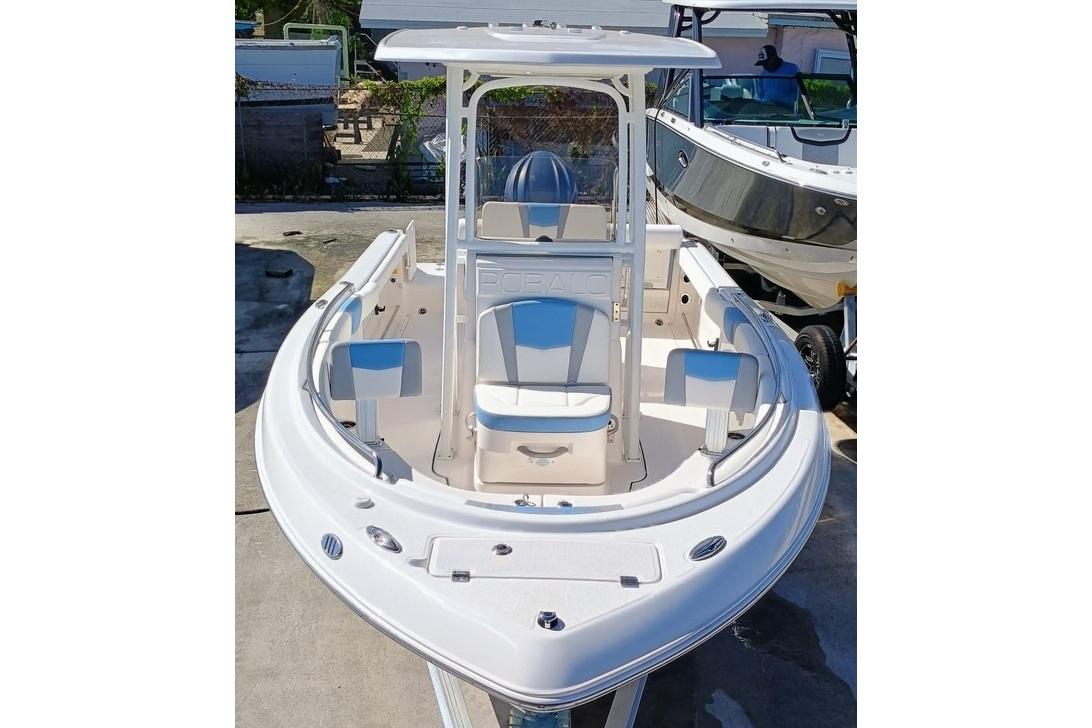 2025 Robalo R222 Center Console boat, white exterior, docked, front view.