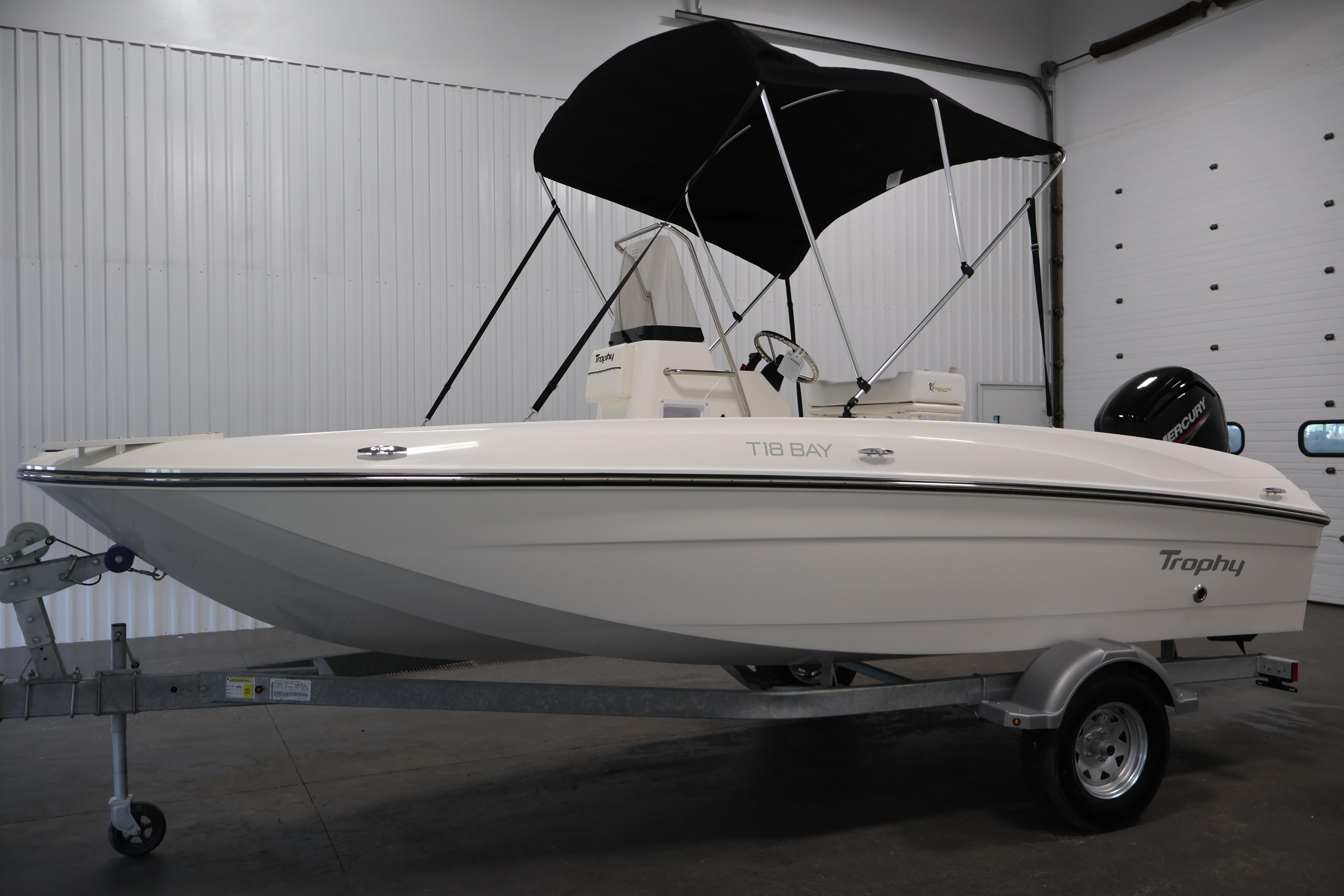 2026 Bayliner Trophy T18 boat with canopy on trailer in indoor setting.