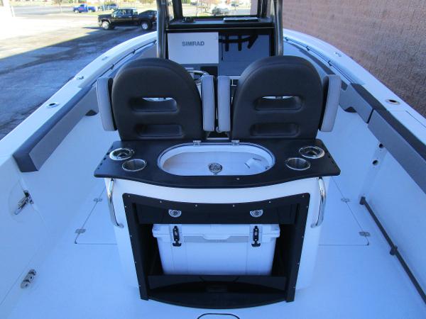 2025 Sea Pro 292 Offshore boat interior with seating and storage.