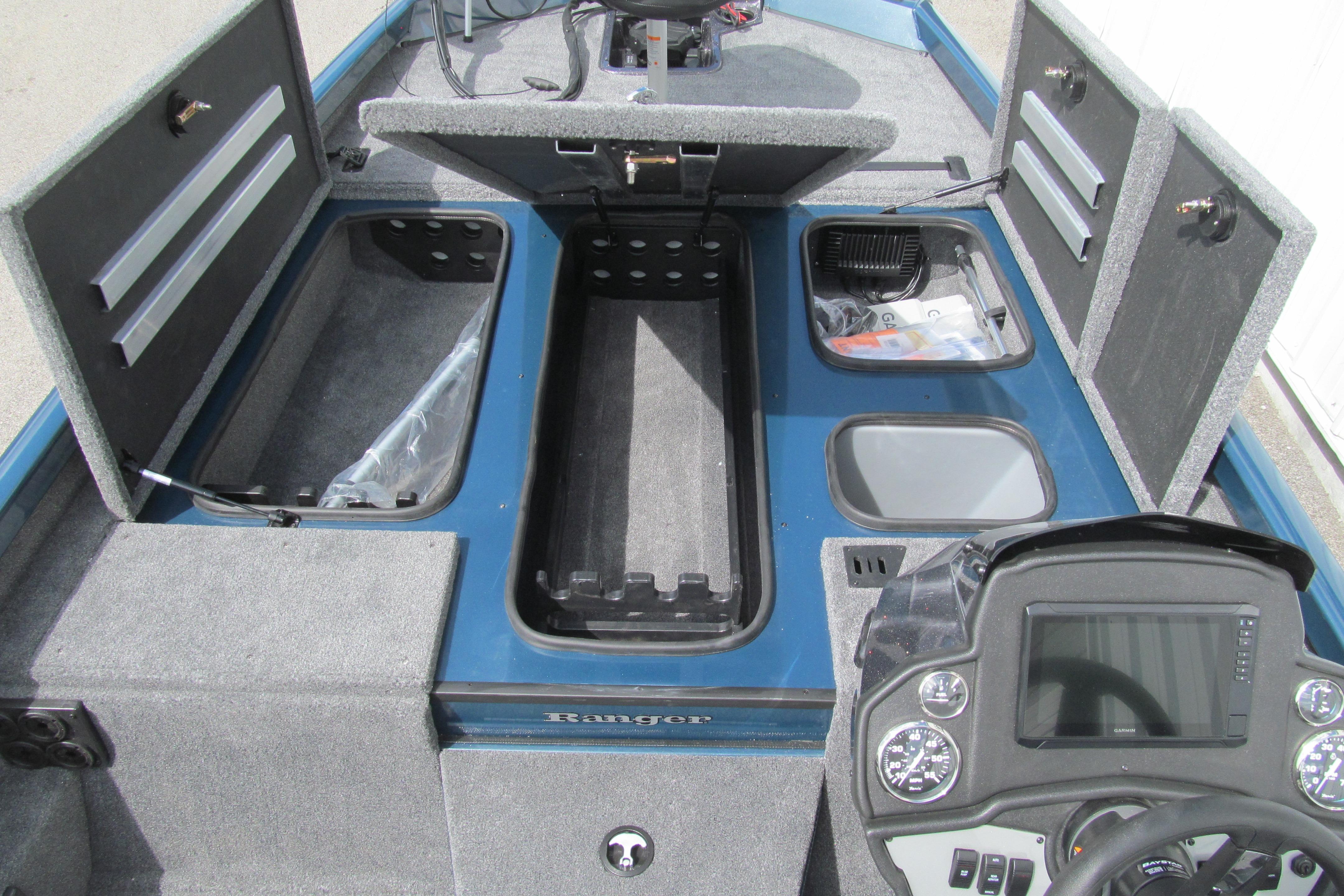 2026 Ranger RT198P boat interior with open storage compartments and control panel.