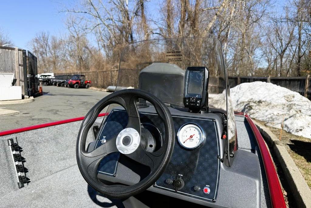 2026 Tracker Bass Tracker Classic XL boat dashboard with steering wheel and RPM gauge.