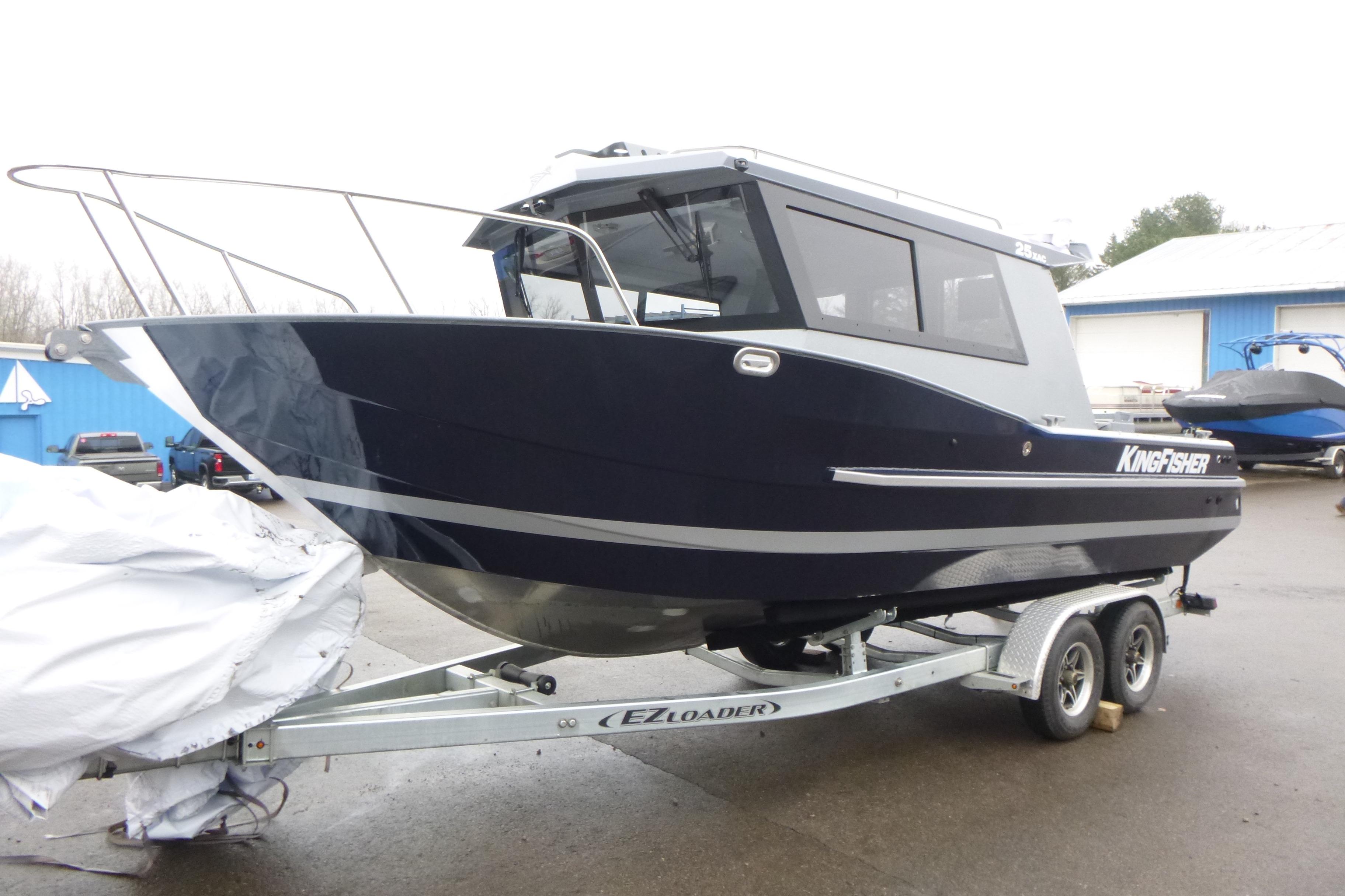 2026 KingFisher 25 XAC boat on trailer, parked outdoors.
