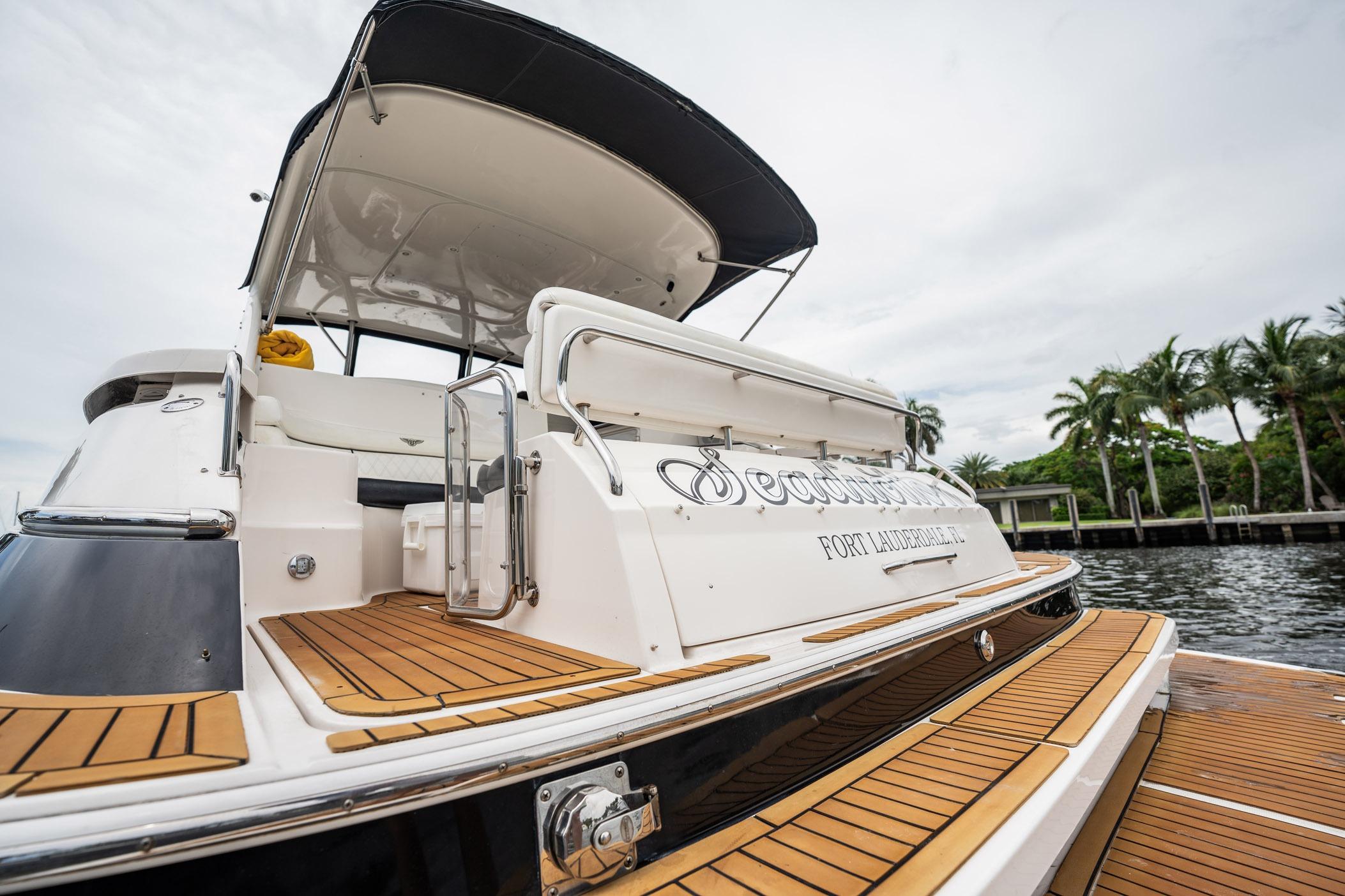 2008 Regal Commodore 4460 yacht docked, featuring teak deck and canopy, Fort Lauderdale.