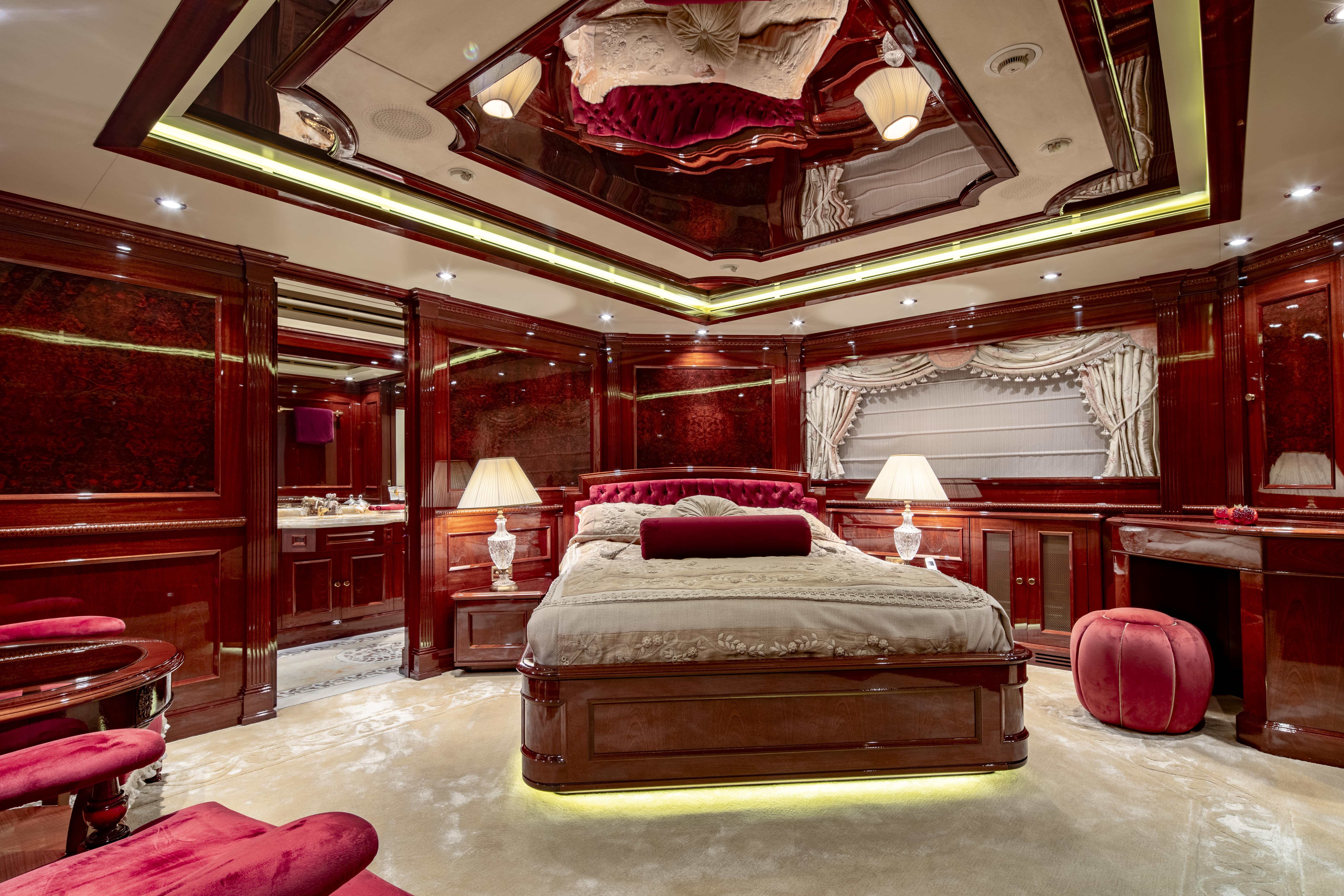 Luxurious yacht bedroom with elegant wood paneling, plush bedding, and ambient lighting, CRN 185, 2008.