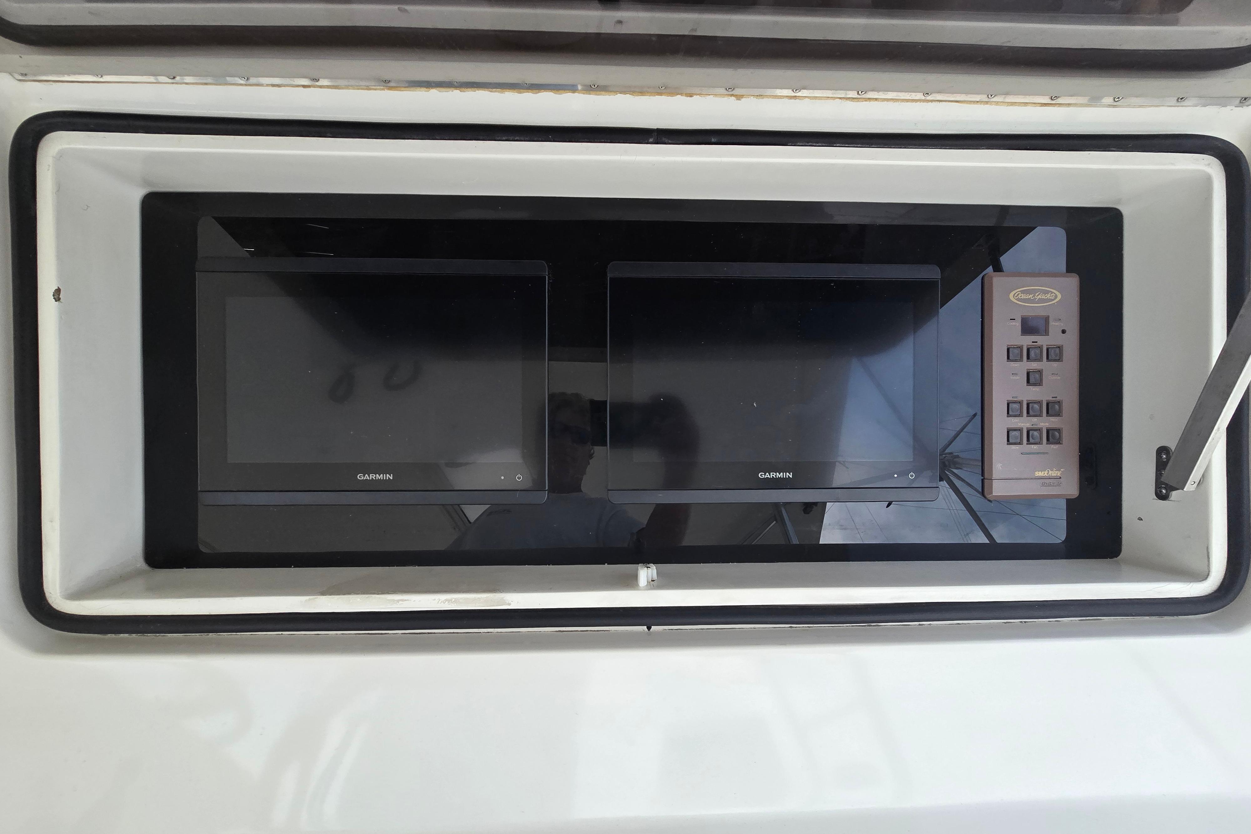 Control panel of 2004 Ocean Yachts 50 Super Sport with Garmin displays.