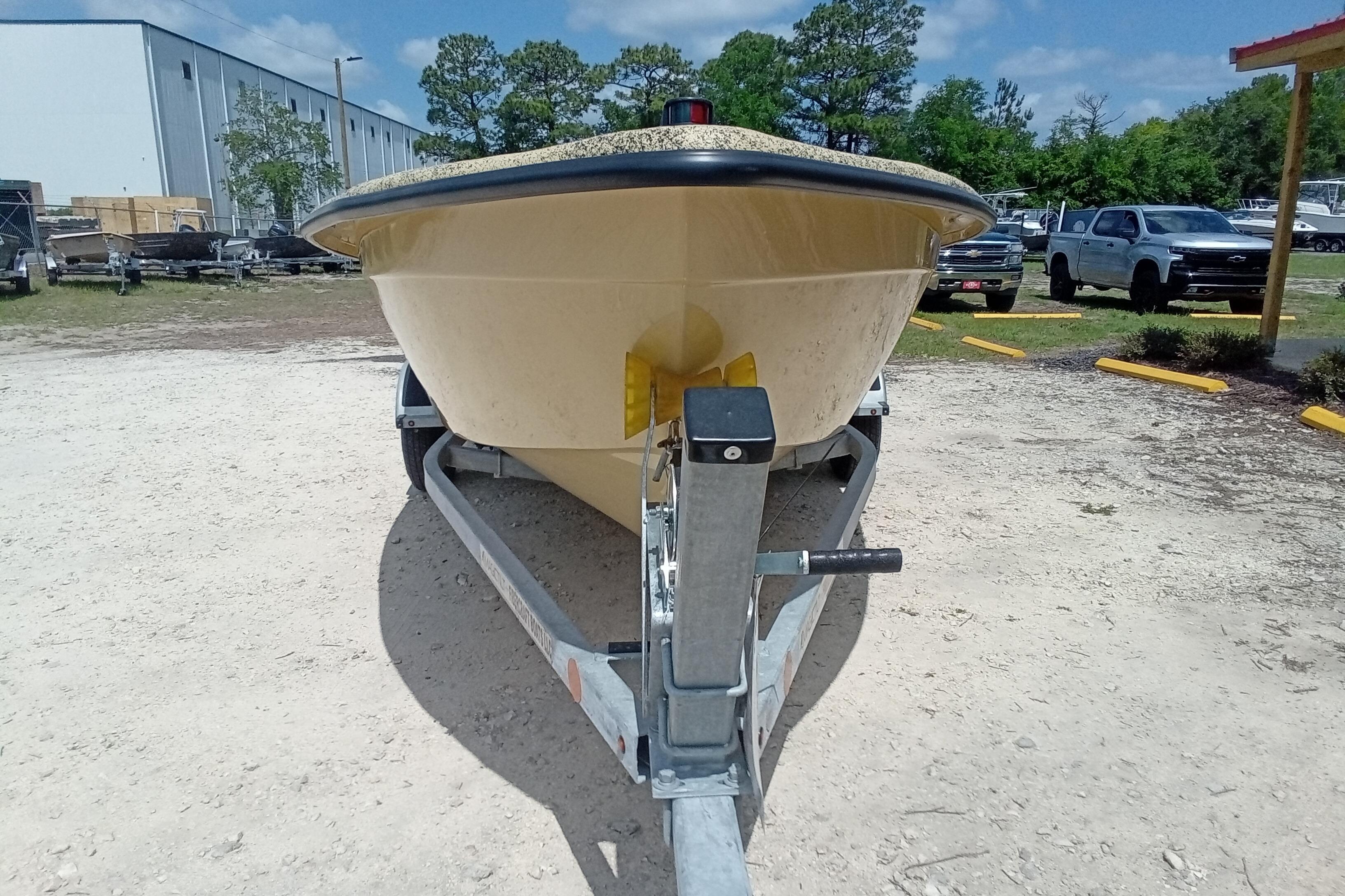 2025 Fibercraft F16 boat on trailer in outdoor lot.