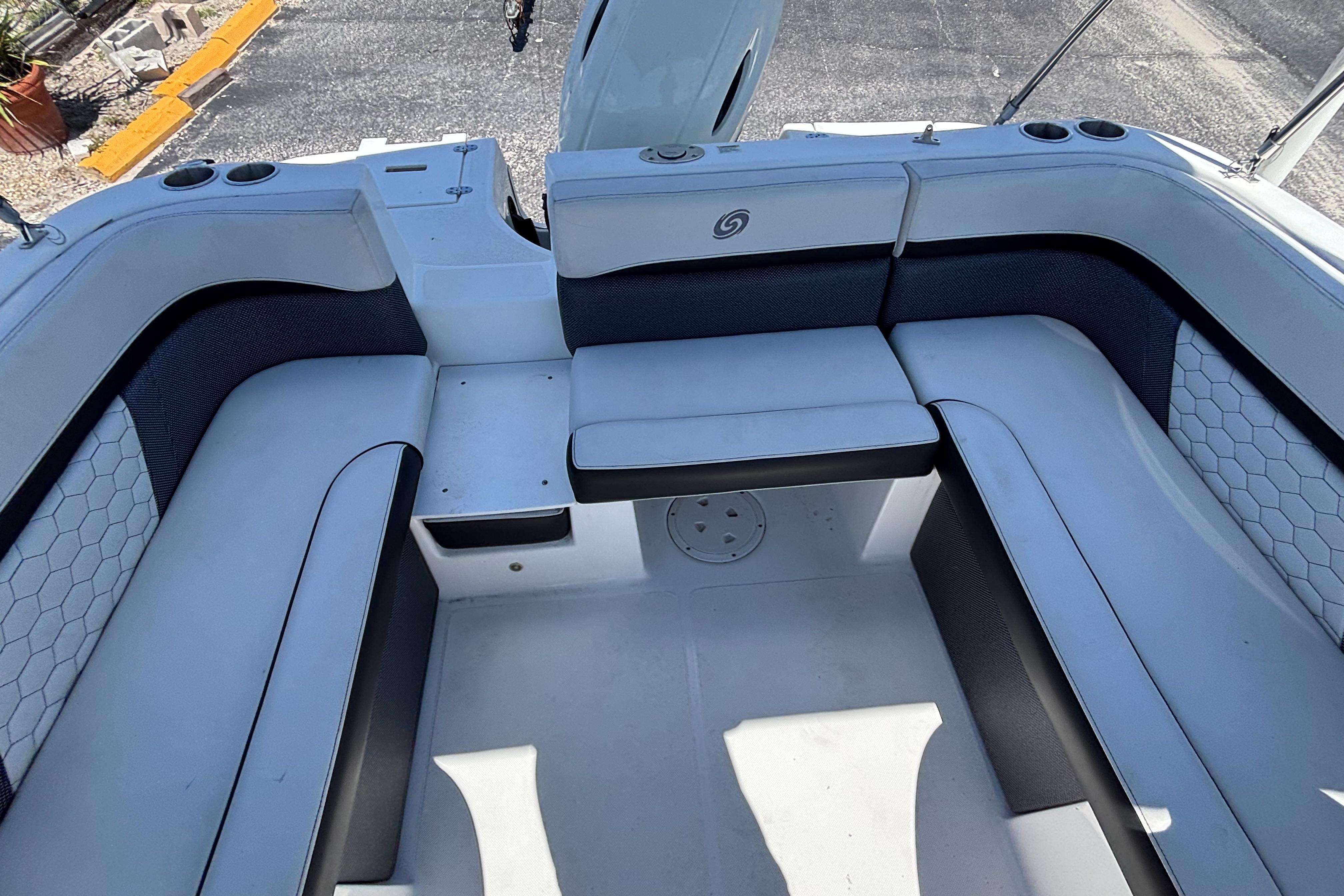 2019 Hurricane Sundeck Sport 218 OB boat interior with spacious seating and cup holders.